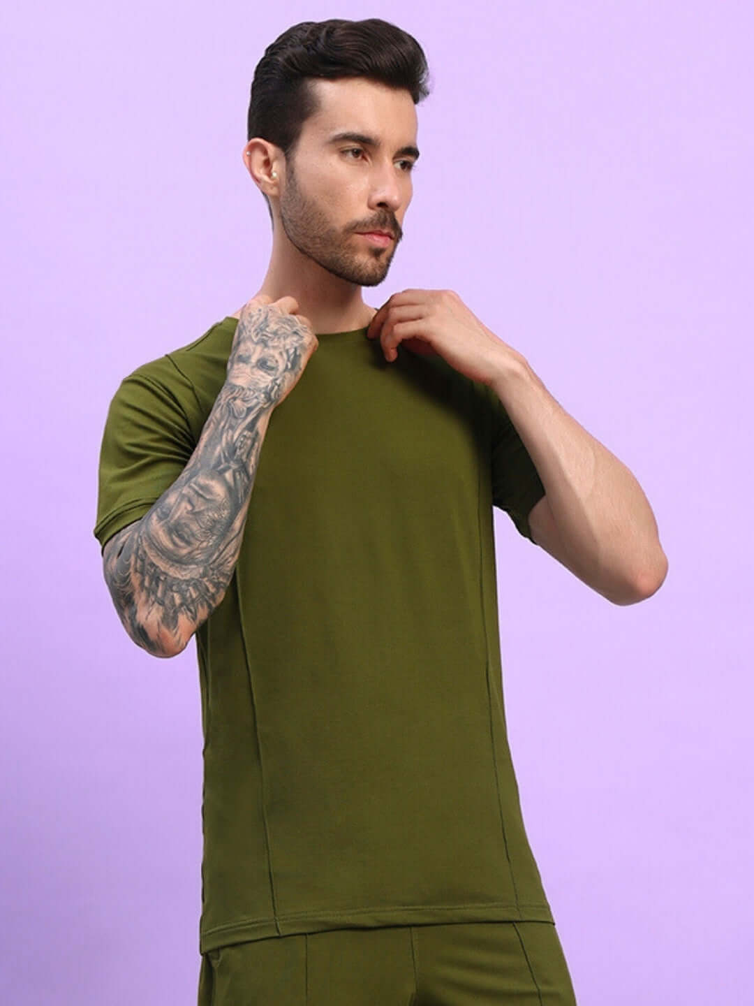 Model wearing GREEBLE Regular Fit T-Shirt in Olive Green, showcasing a trendy summer style in lightweight, breathable cotton.