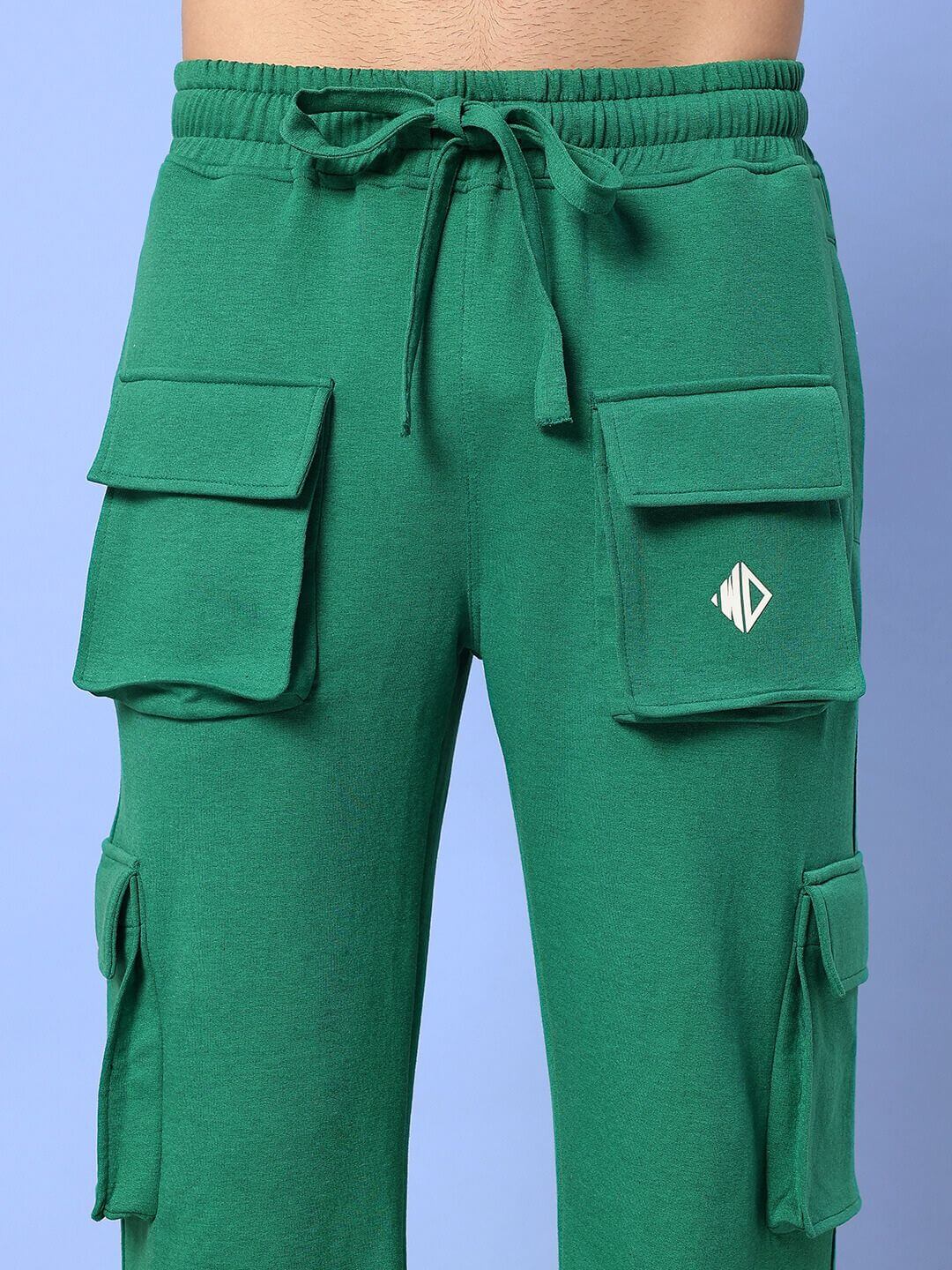 Green cargo pants with pockets and drawstring, casual wear.