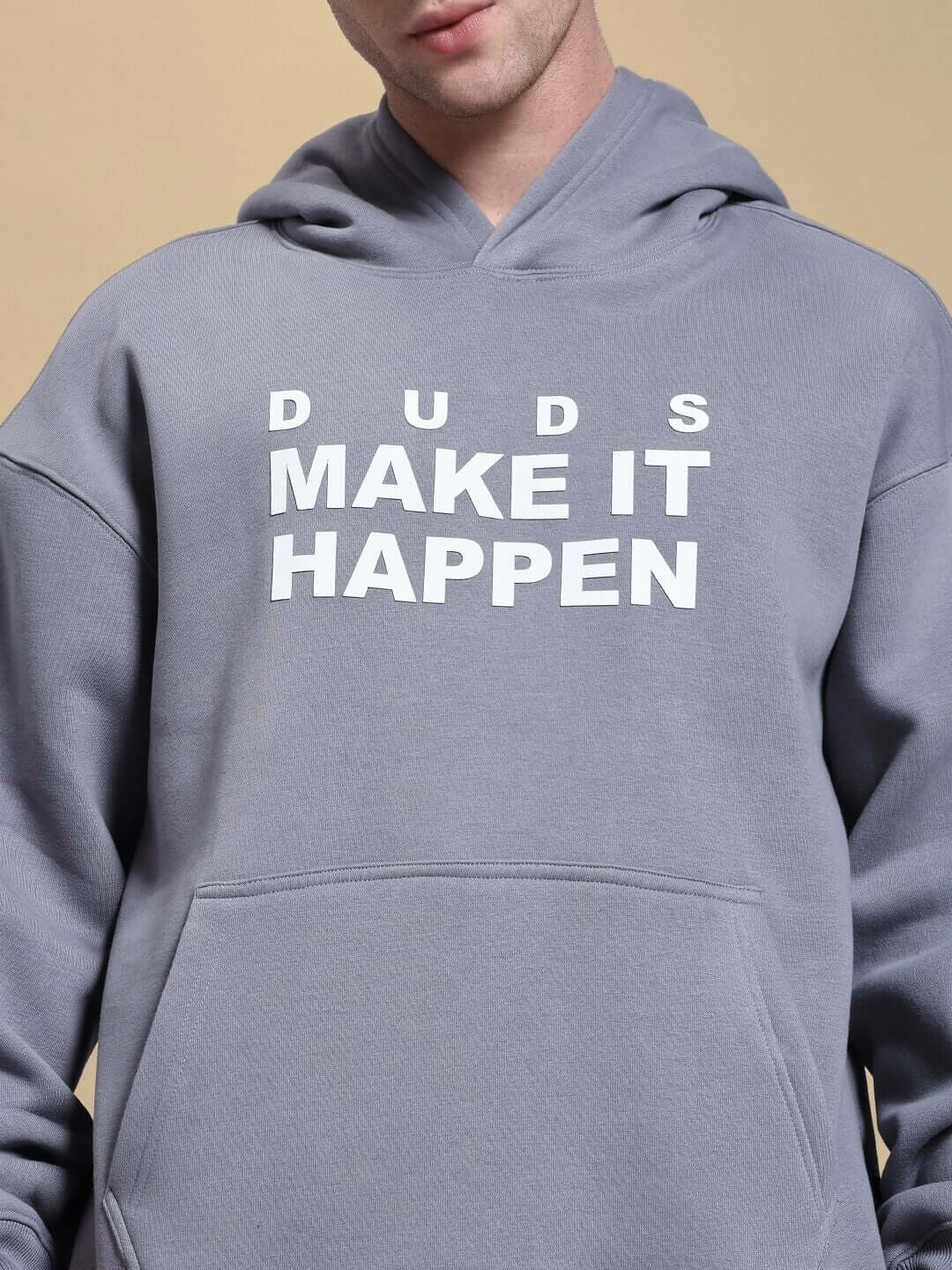 Man wearing MAKE IT HAPPEN FLEECE CO-ORD SET GREY sweatshirt with bold text detail.