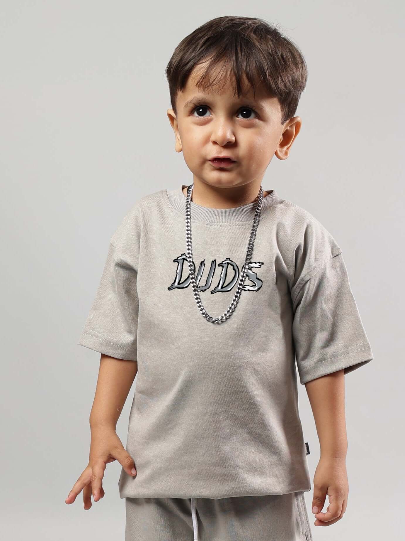 Child wearing grey positive rabbit t-shirt for boys & girls, designed by DUDS, featuring a casual look. Made-to-order with custom fit option.