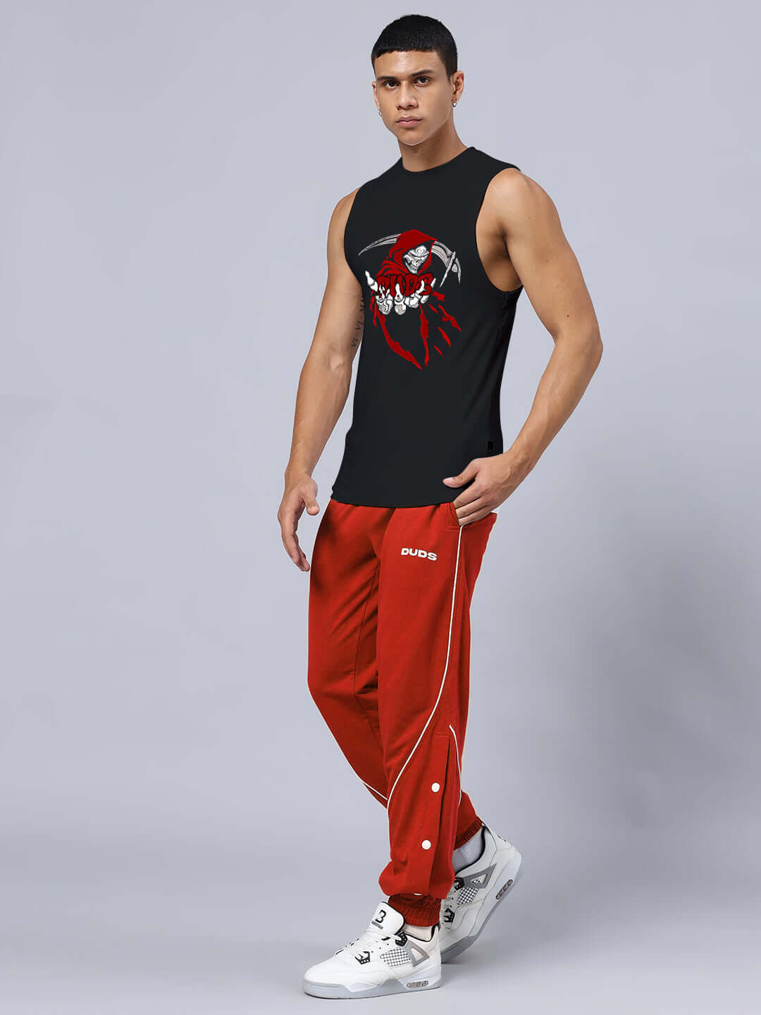 Model wearing GRIM REAPER PRINTED GYM RELAXED FIT CO-ORD SET BLACK-RED with sleeveless top and joggers.