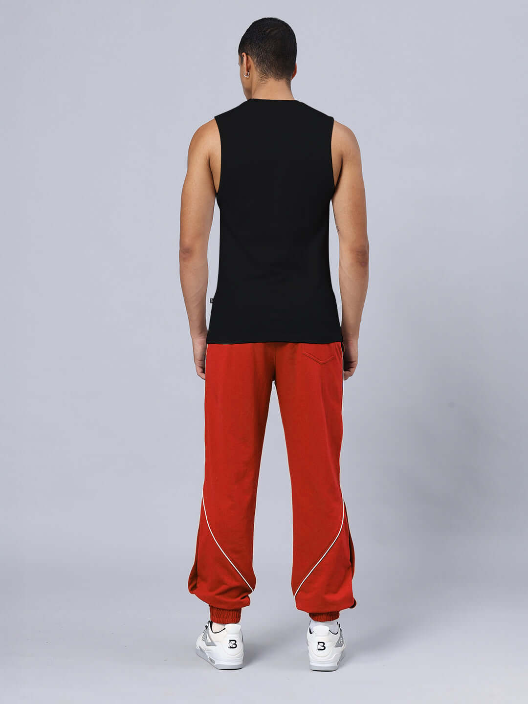 Back view of model wearing GRIM REAPER PRINTED GYM RELAXED FIT CO-ORD SET BLACK-RED, showcasing unisex cotton joggers.