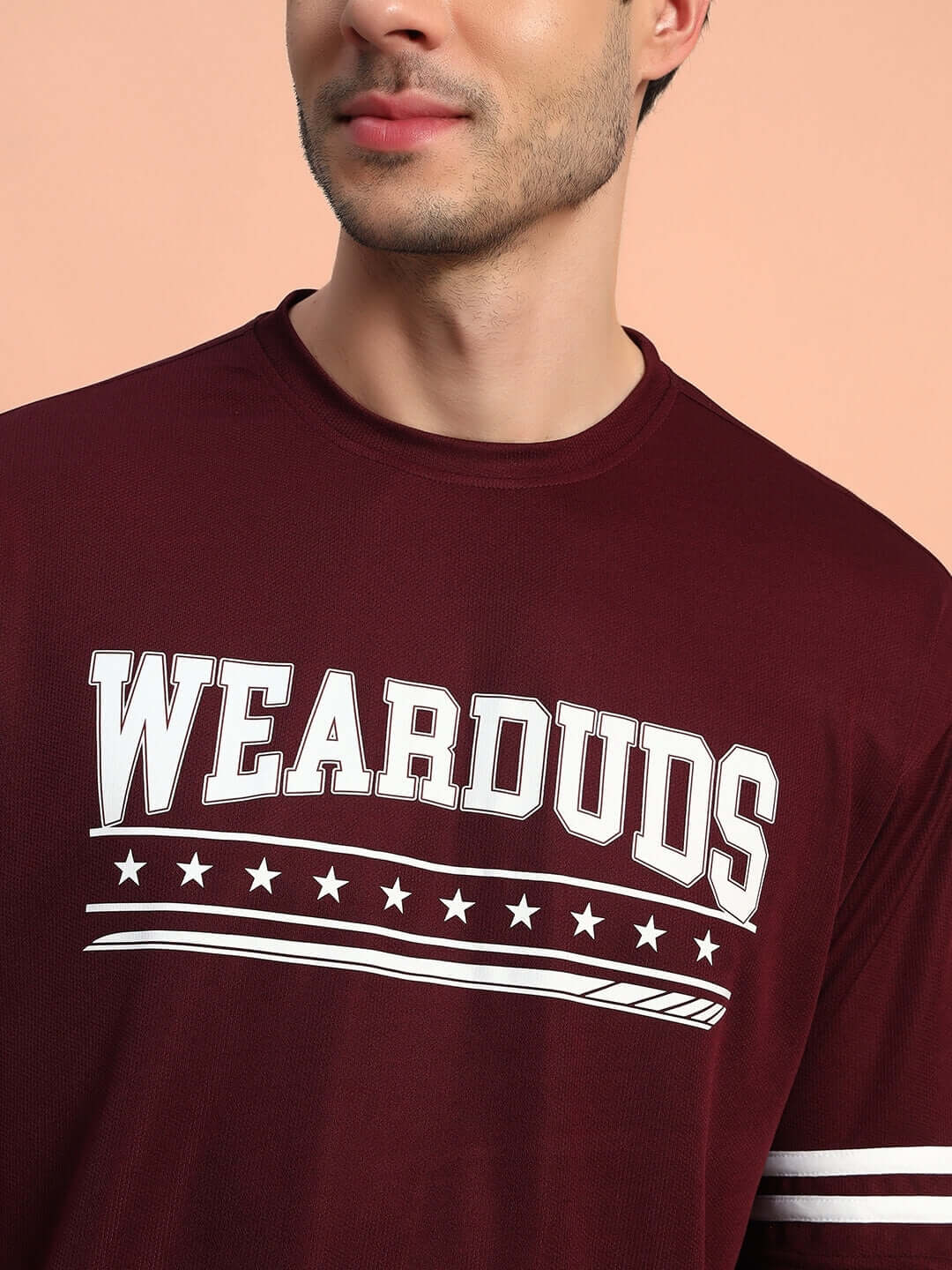 Model wearing WEAR DUDS t-shirt, part of GROOVY COLORBLOCK CO-ORD SET WINE, featuring bold streetwear style.