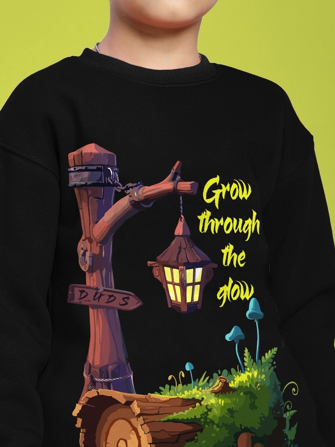GROW AND GLOW PRINT FLEECE CO-ORD FOR BOYS AND GIRLS BLACK on a child's sweater with a lantern illustration.