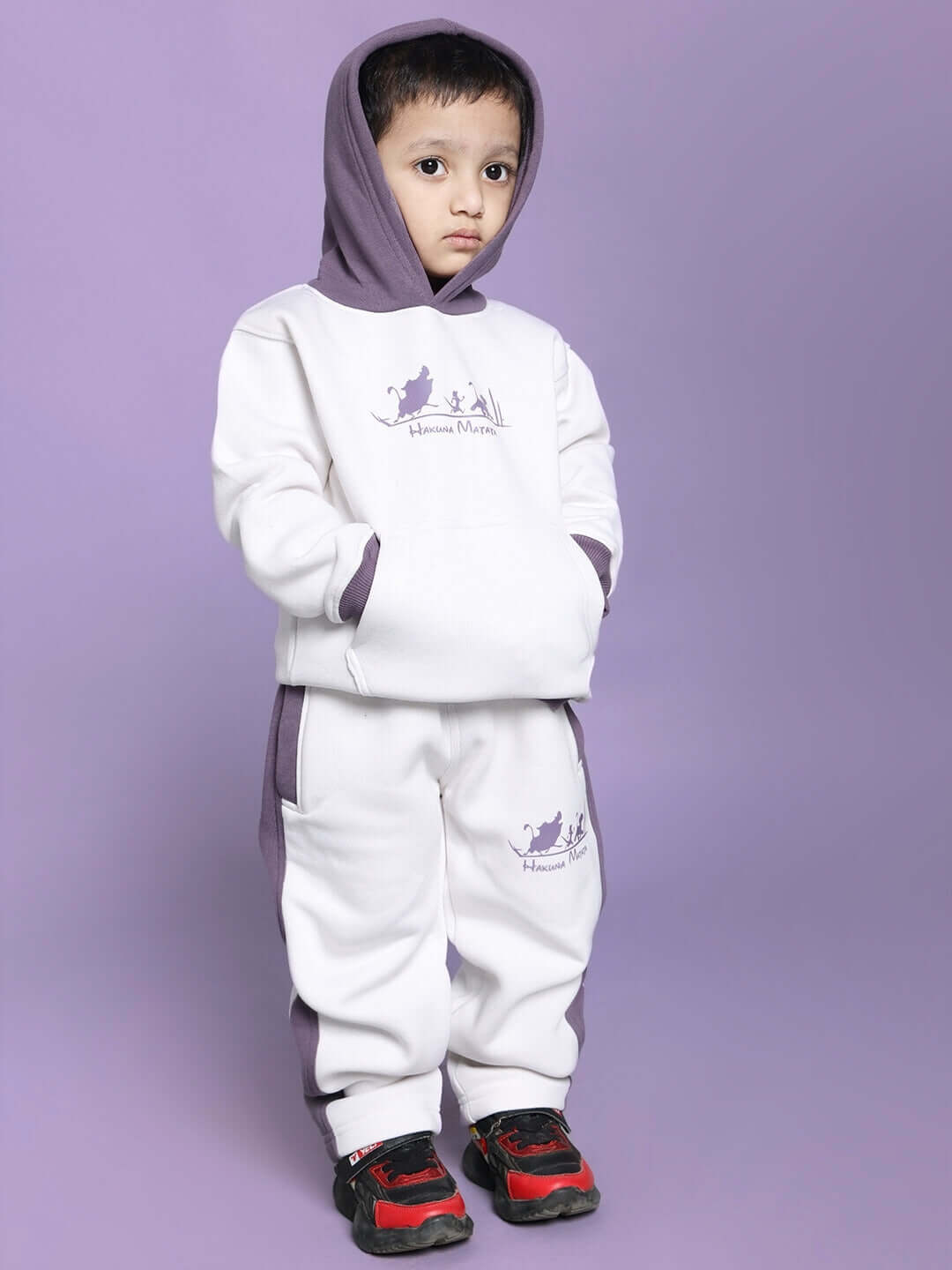 Child wearing HAKUNA MATATA FLEECE CO-ORD FOR BOYS GIRLS WHITE VIOLET with hoodie, perfect for cozy and stylish comfort.