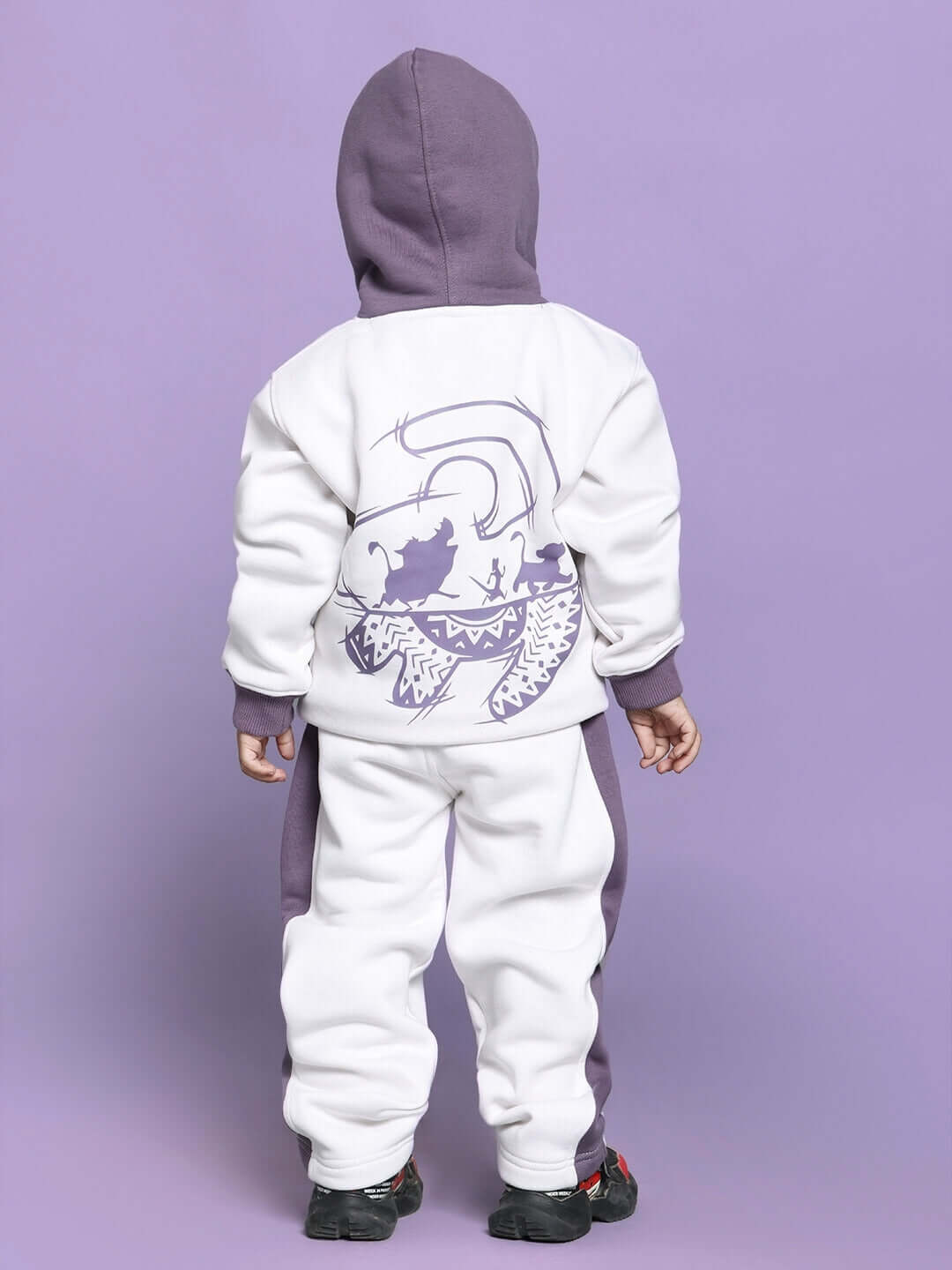 Child wearing Hakuna Matata Fleece Co-ord for Boys Girls White Violet, featuring a hooded sweatshirt and joggers with playful design.