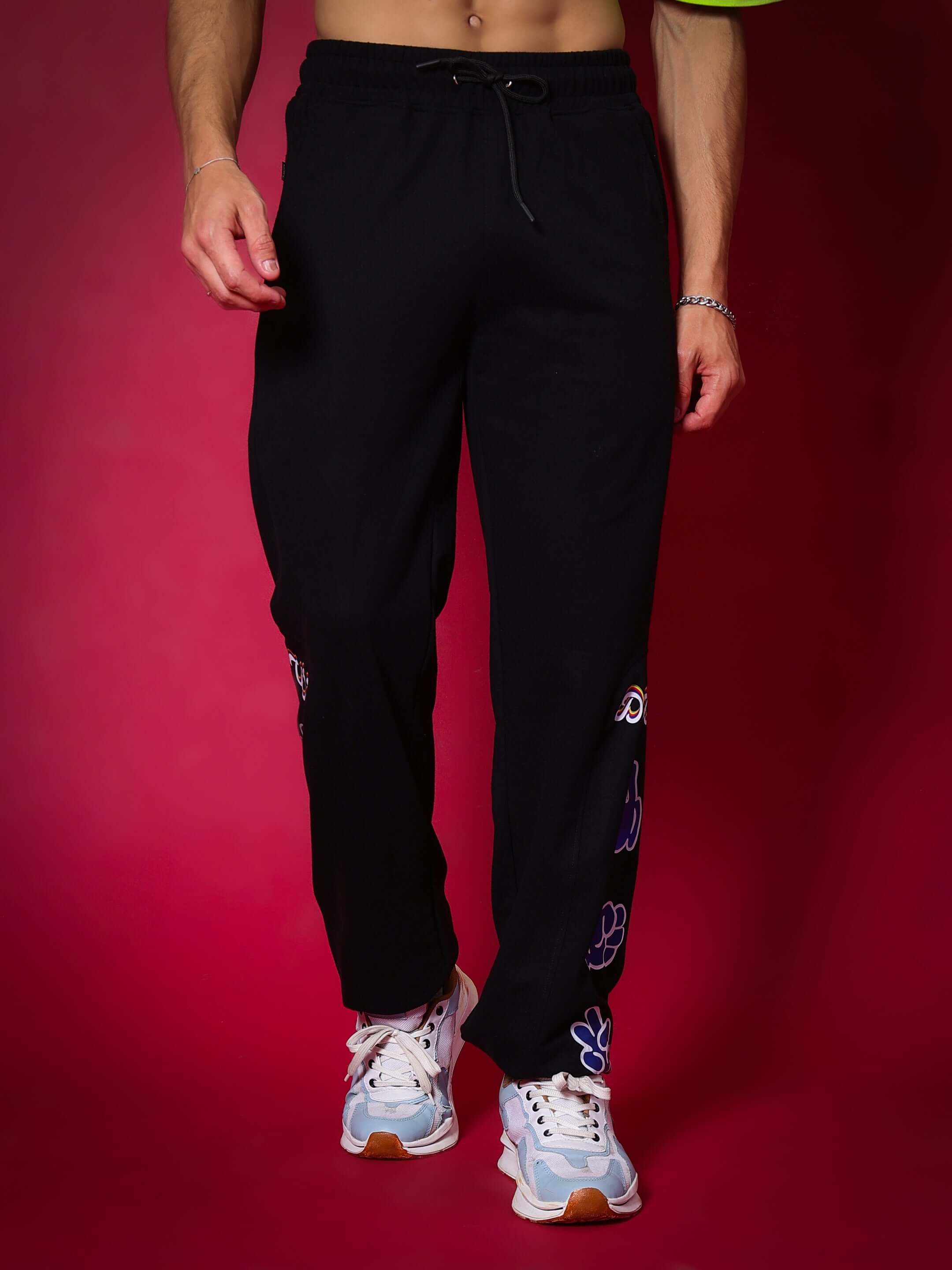 Model wearing black Hand Gestures Relaxed Pant Jogger with unique embroidery, showcasing casual style.