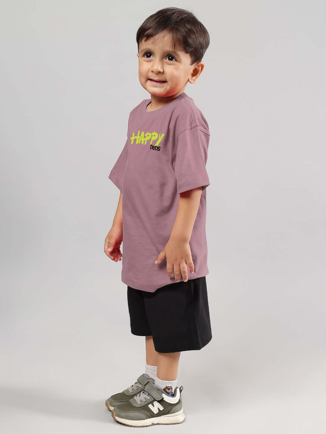 Child wearing HAPPY DUDS co-ord set in Chinese violet and black, showcasing comfortable and stylish attire for kids.