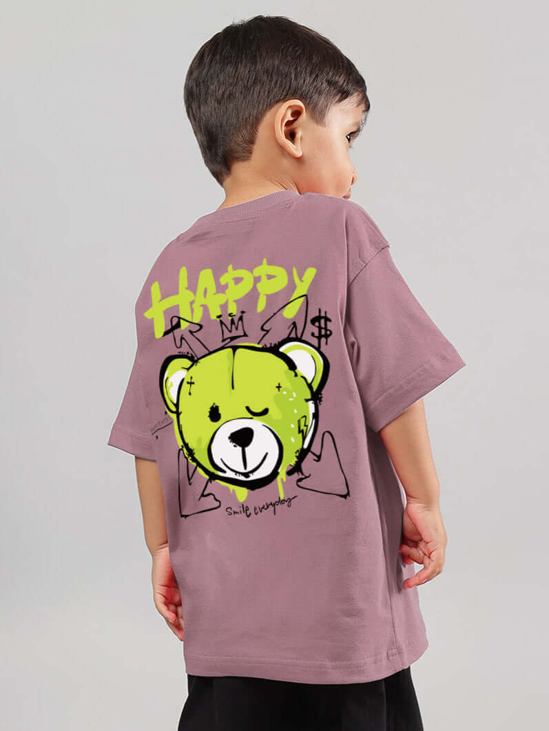 Child wearing oversized Happy Duds T-shirt in Chinese Violet with playful bear graphic on back.