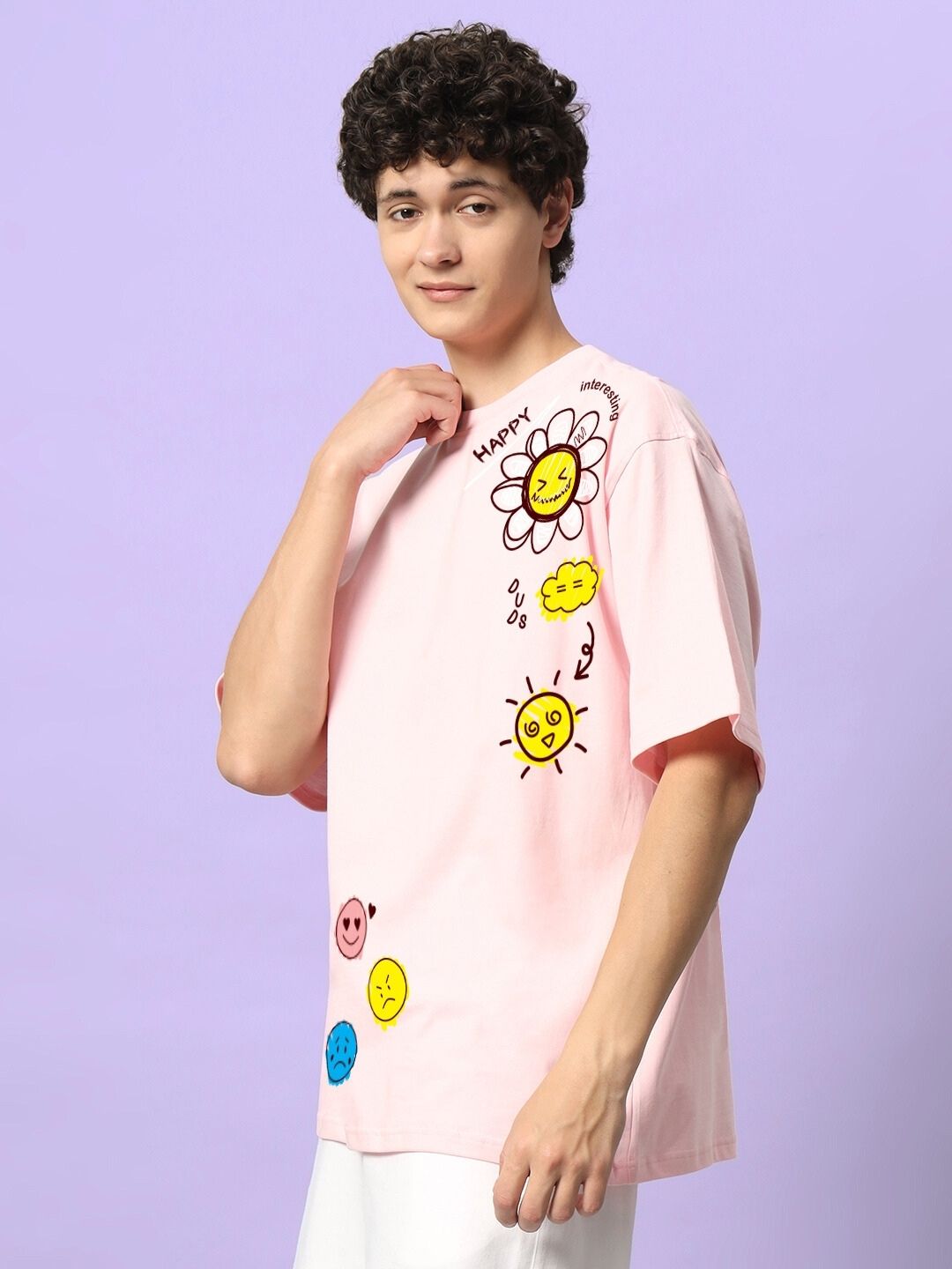 HAPPY INTERESTING OVERSIZED T-SHIRT PINK with graphic designs worn by model against a purple background.