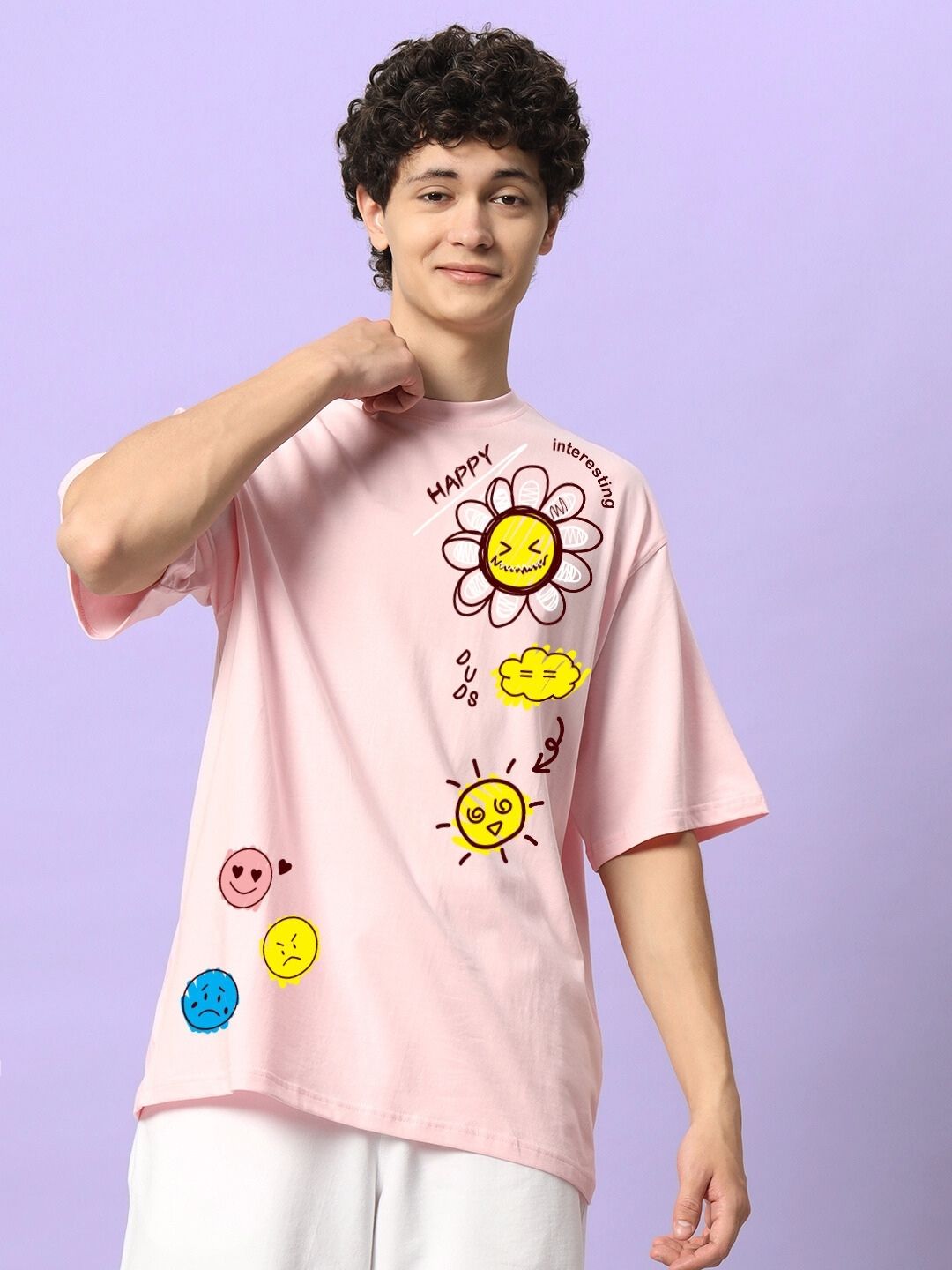 Model wearing HAPPY INTERESTING OVERSIZED T-SHIRT PINK with fun graphics and positive vibes.