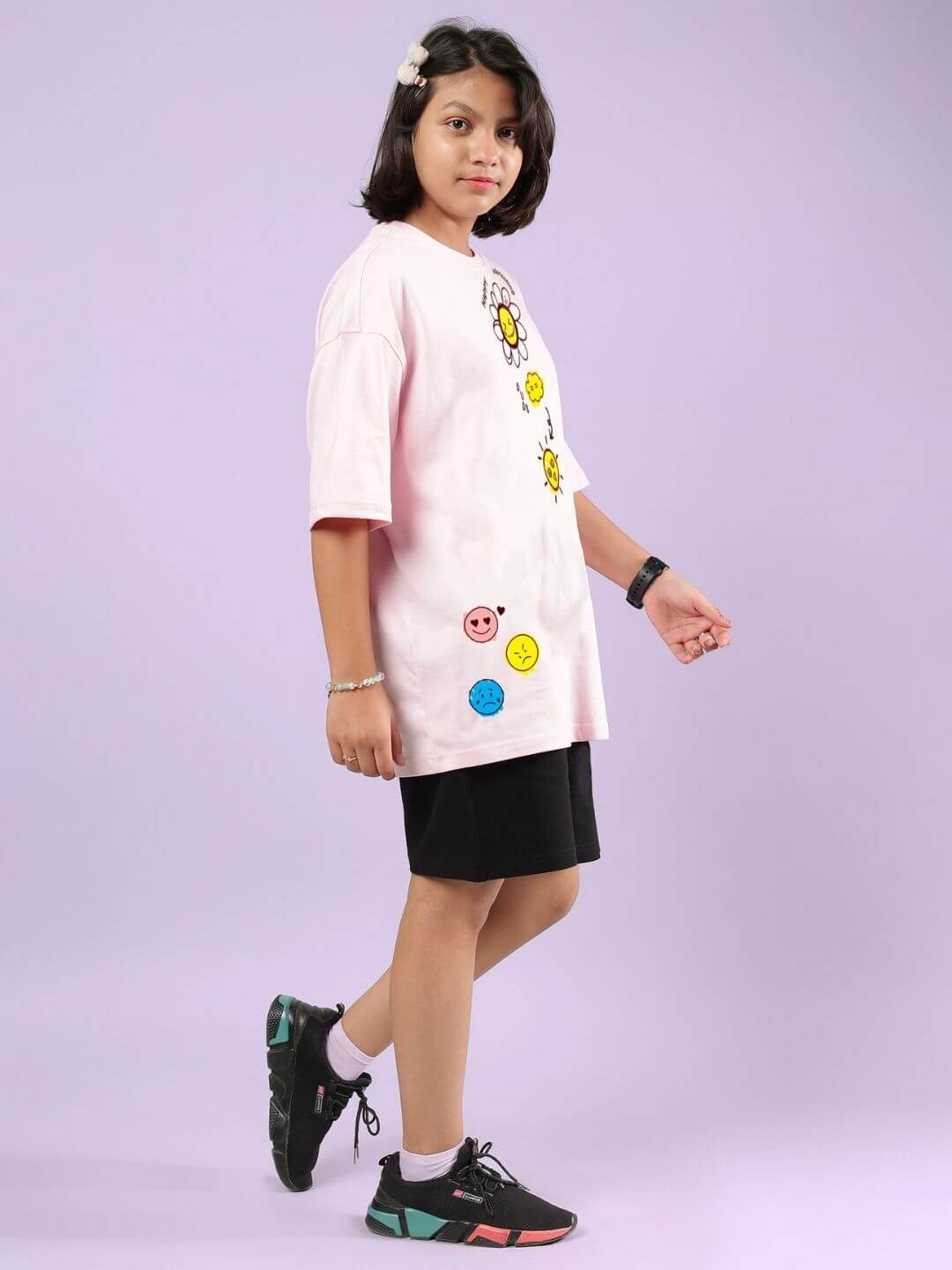 Child wearing HAPPY INTERESTING CO-ORD FOR BOYS AND GIRLS PINK-BLACK, playful outfit with emojis, soft cotton-blend, stylish and comfortable.