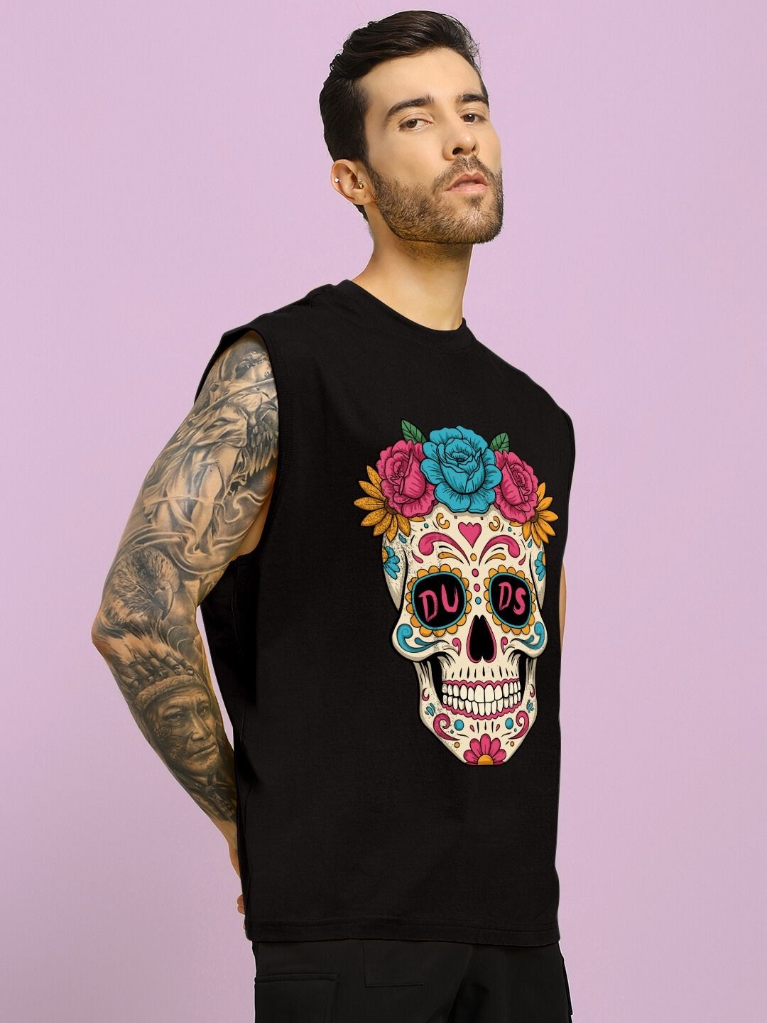 Man wearing HAPPY SKULL PRINTED GYM T-SHIRT BLACK with colorful skull design on the front, perfect for workouts or casual wear.