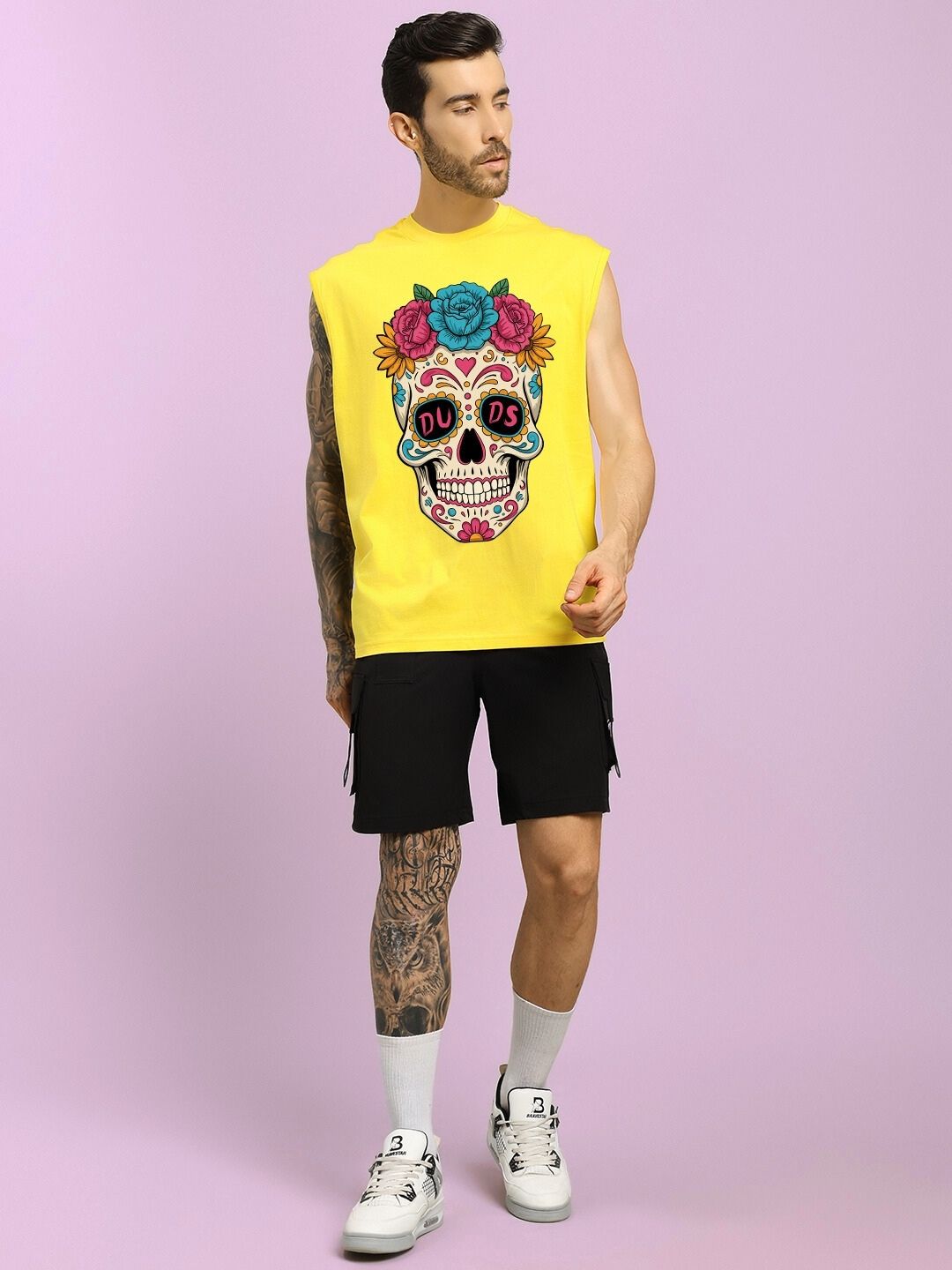 Man wearing HAPPY SKULL PRINTED GYM T-SHIRT YELLOW with black shorts