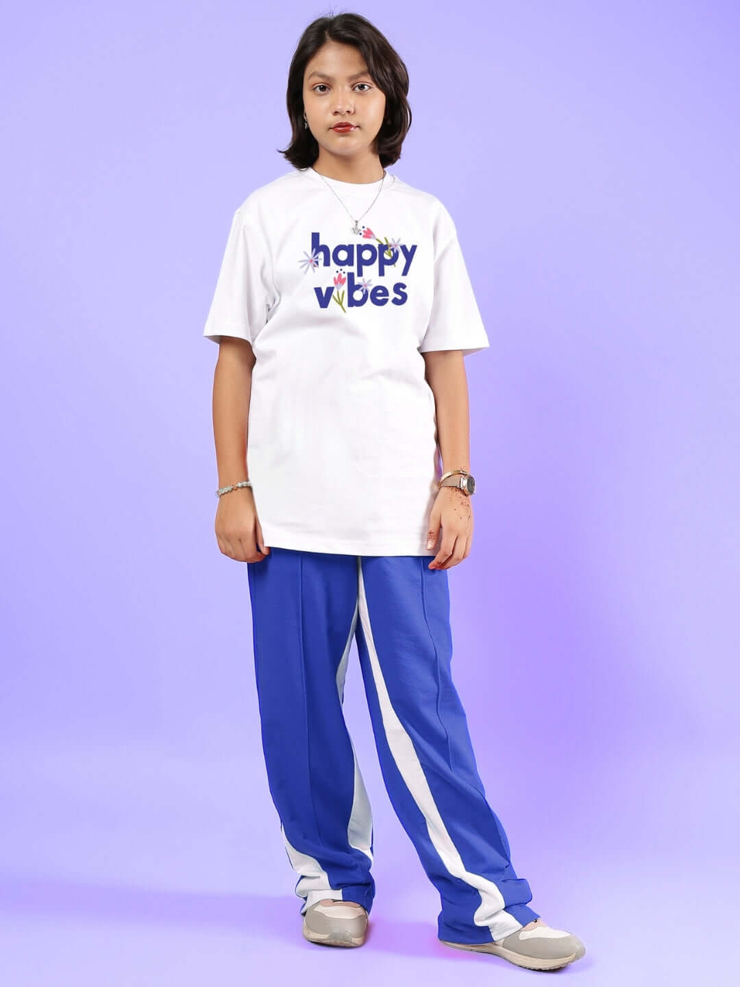 HAPPY VIBES CO-ORD FOR BOYS & GIRLS WHITE-BLUE featuring a child wearing a white t-shirt and blue pants.