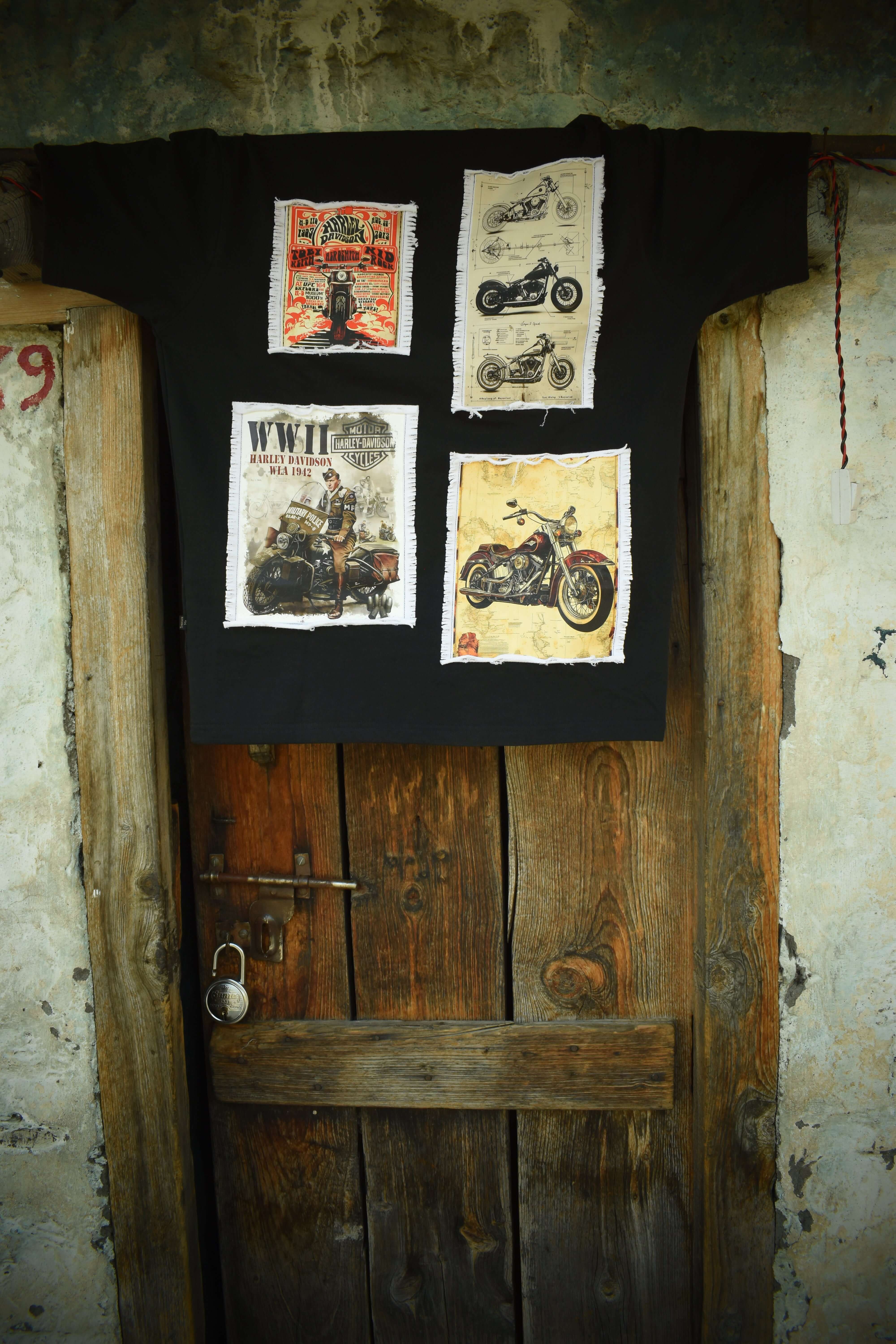 HARLEY DESIGNER OVER-SIZED T-SHIRT BLACK hanging on a rustic wooden door, showcasing unique motorcycle designs in a vintage setting.