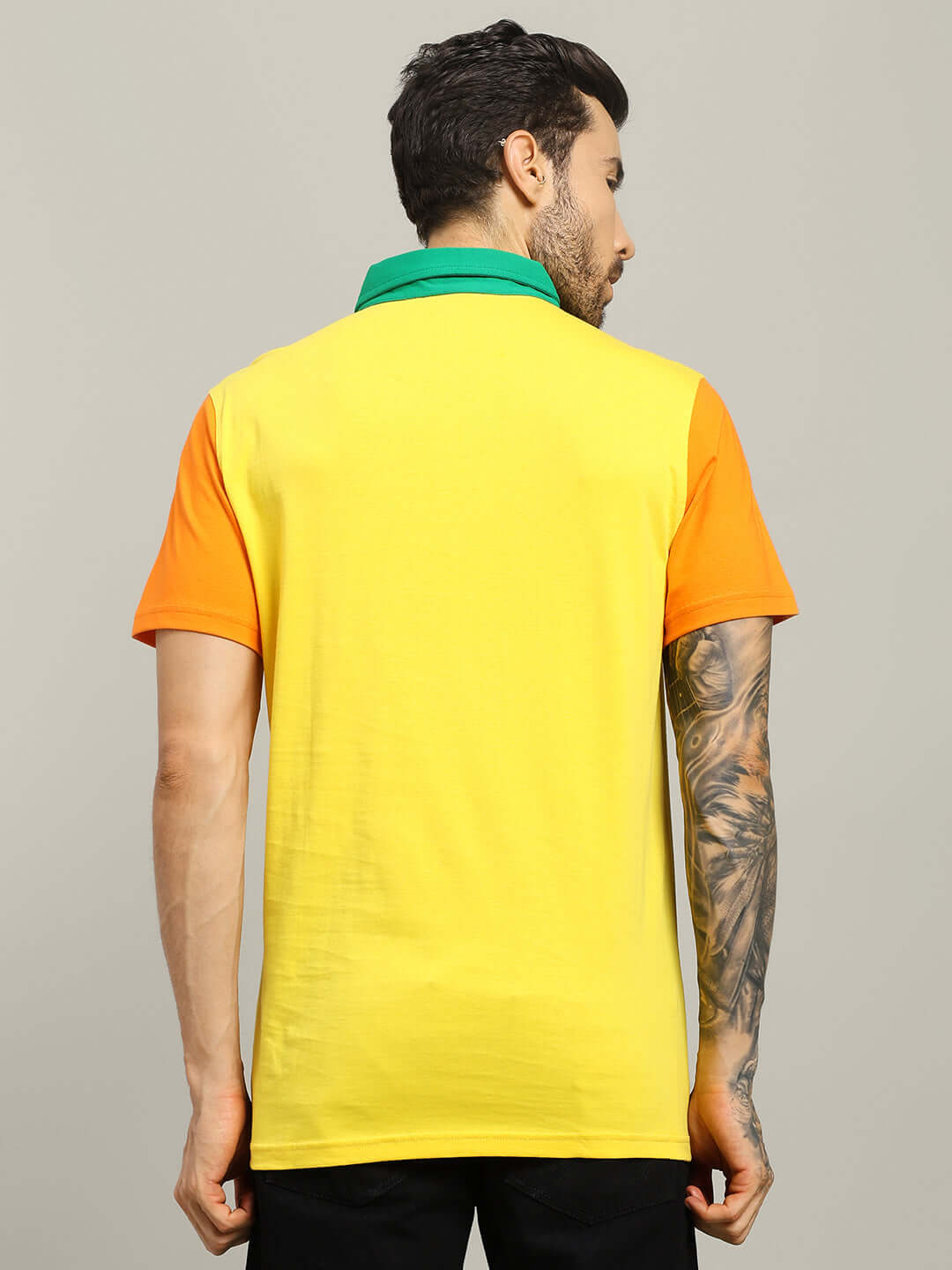 HARRY CONTRASTING POLO T-SHIRT YELLOW - model wearing half-sleeve, comfortable for all day wear, showing back view with orange and yellow design.