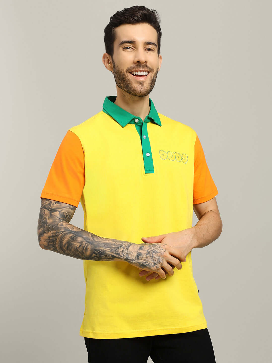Man wearing HARRY CONTRASTING POLO T-SHIRT YELLOW with green collar and orange sleeves, suitable for casual or all-day wear.