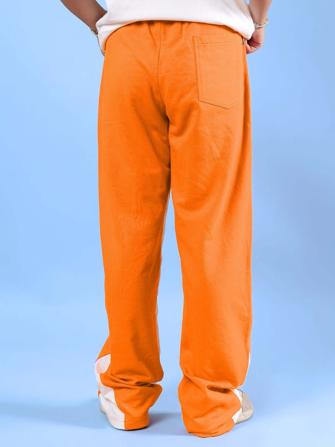 Back view of HELLO SPRING CO-ORD FOR BOYS & GIRLS WHITE-ORANGE pants against blue backdrop.