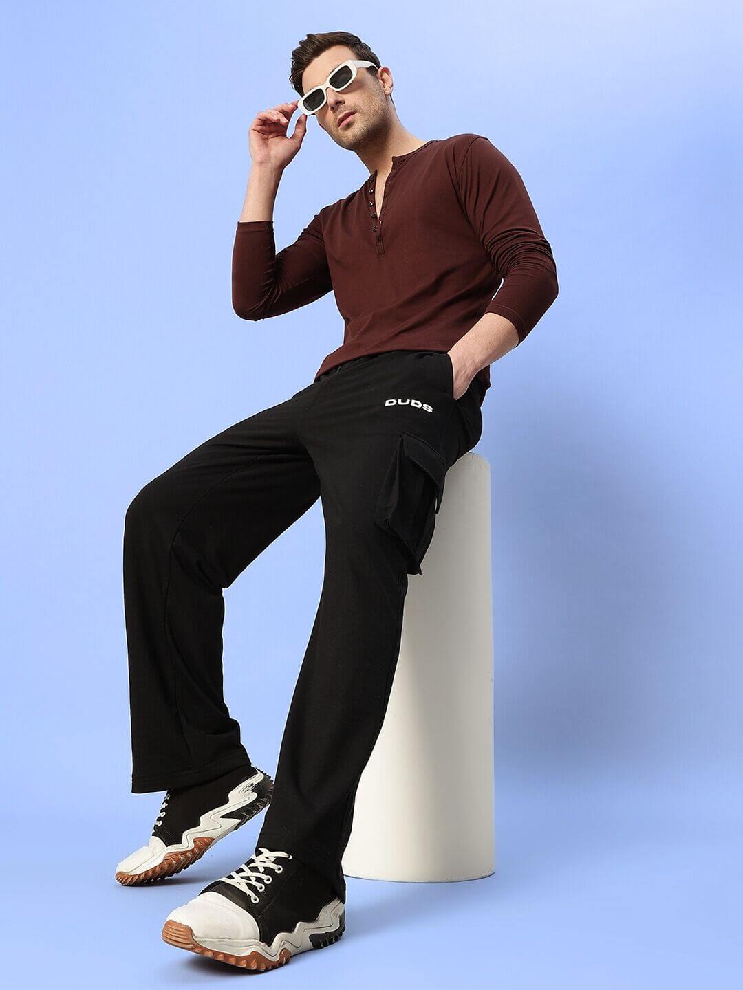 Model wearing HENNY RELAXED FIT CO-ORD SET BROWN-BLACK, showcasing relaxed fit and style for kids, unisex fashion outfit.