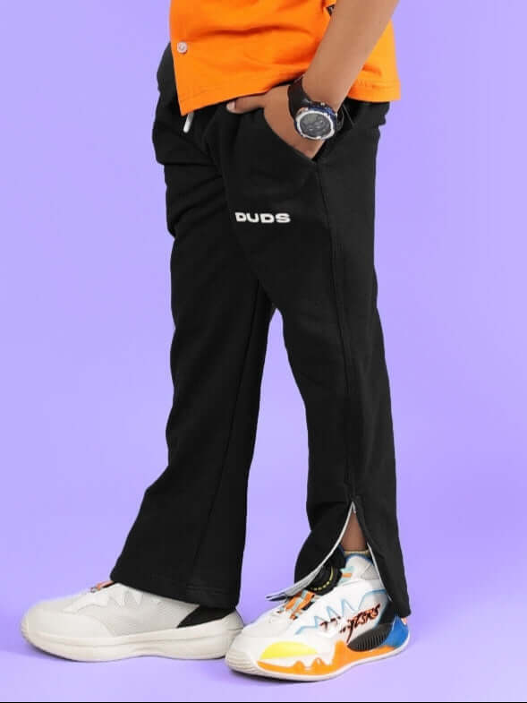 Boy wearing HERSHEY JOGGER FOR BOYS & GIRLS BLACK by DUDS, featuring customizable fit and quality tailoring.