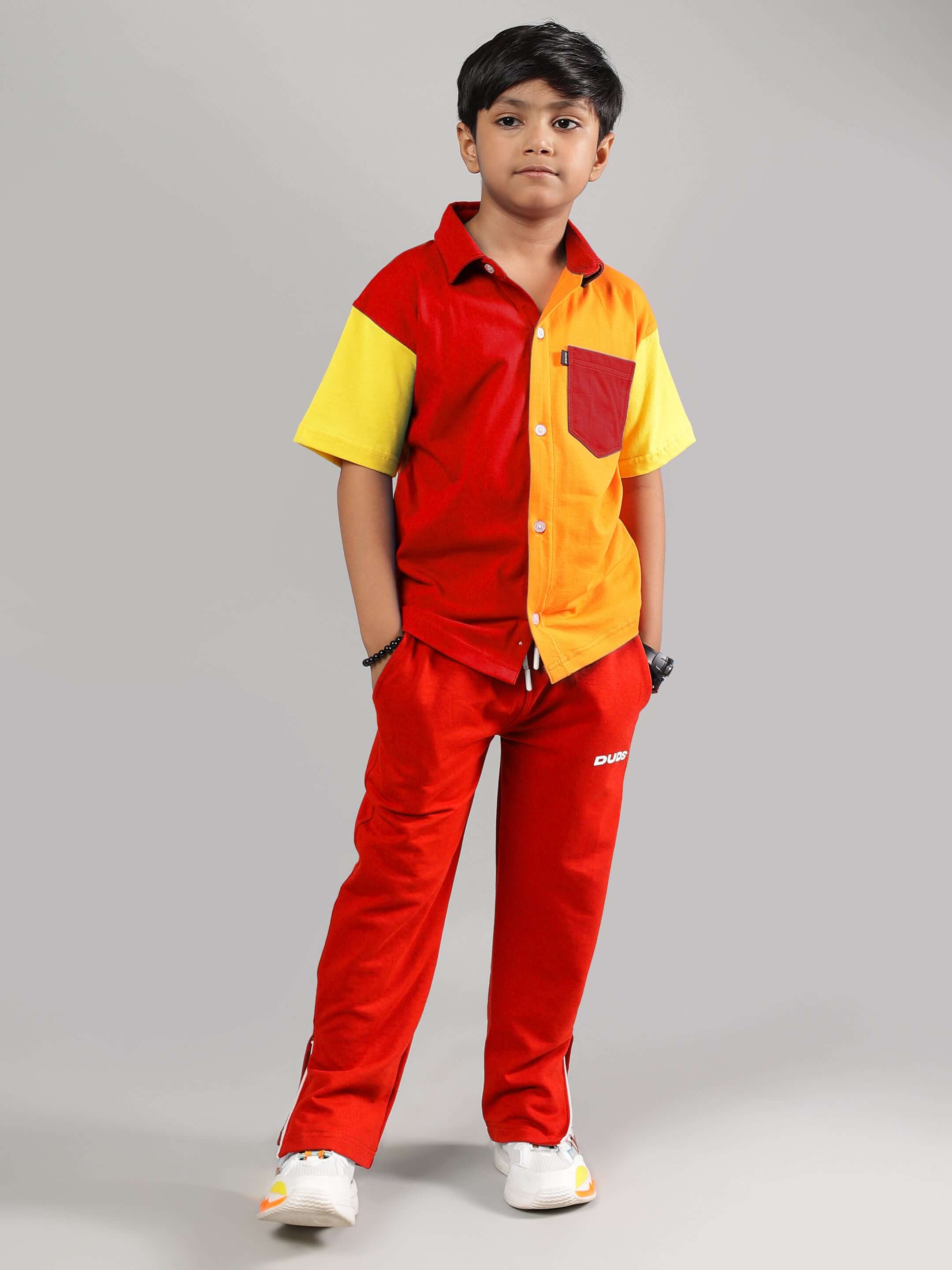 Young child wearing HERSHEY JOGGER FOR BOYS & GIRLS RED, showcasing vibrant design and comfort for all-day wear.