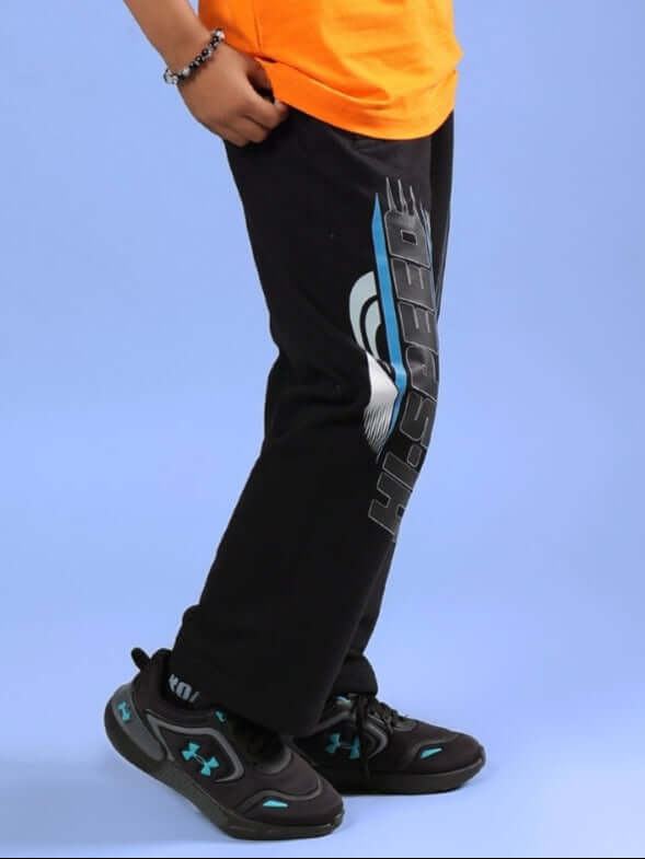 Child wearing HI SPEED JOGGER FOR BOYS & GIRLS BLACK, showcasing style and comfort. Ideal for casual wear.