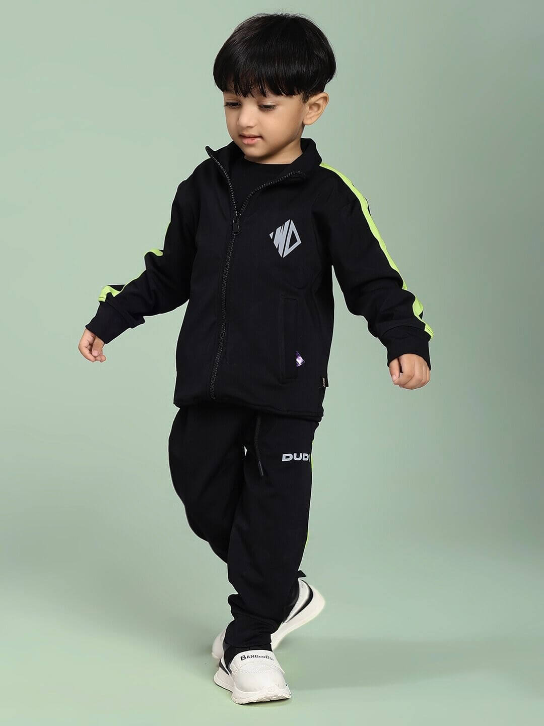 Child wearing HIGH PERFORMANCE CO-ORD SET FOR BOYS AND GIRLS BLACK, showcasing a stylish and comfortable unisex outfit for active kids.
