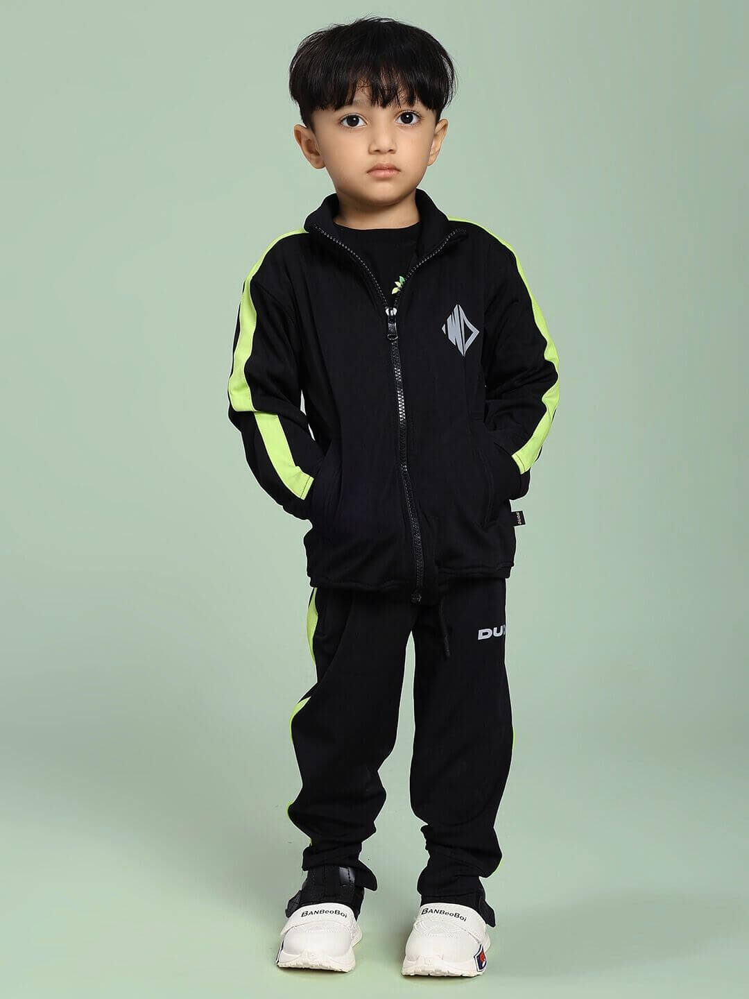Child wearing HIGH PERFORMANCE CO-ORD SET FOR BOYS AND GIRLS BLACK, showcasing stylish and comfortable activewear for kids.