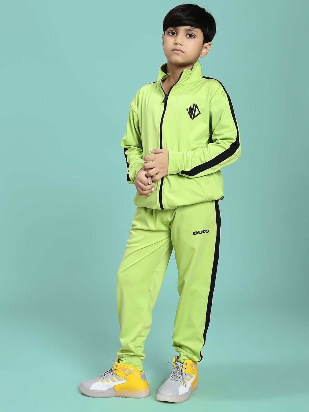 Child wearing the HIGH PERFORMANCE CO-ORD SET FOR BOYS AND GIRLS NEON GREEN suitable for active kids' comfort and style.