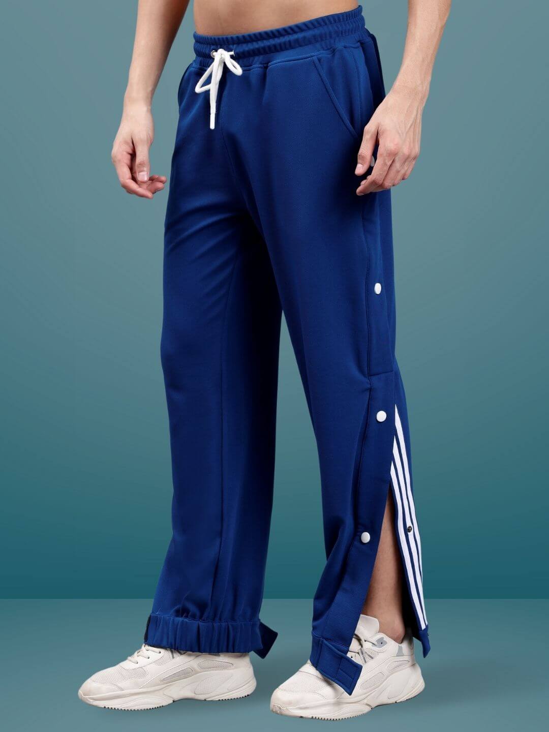 Marine Blue hip hop joggers with buttoned side slits, customizable fit available, showcased on a model.