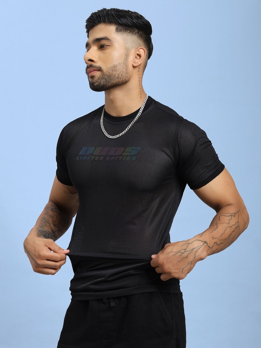 Man wearing HOLO BLACK MESH REGULAR FIT T-SHIRT BLACK, showcasing mesh panel design and comfortable fit.