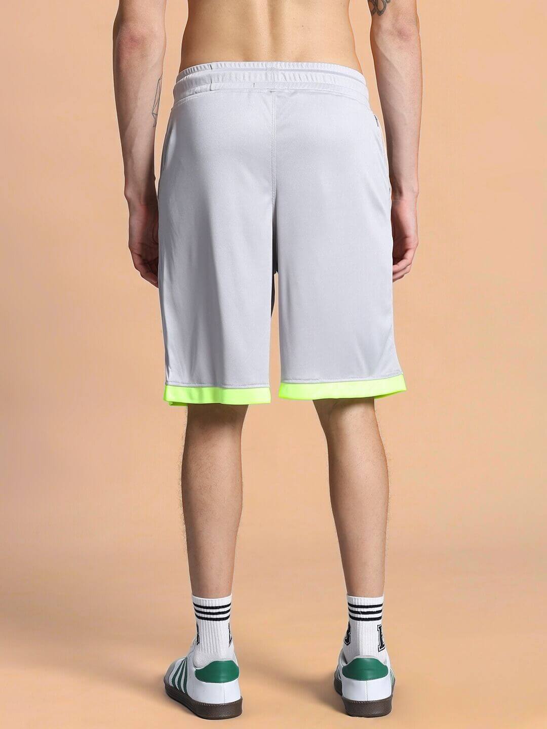 Back view of a person wearing HOOKUP REGULAR FIT SHORTS GREY, showcasing stylish design and comfortable fit.