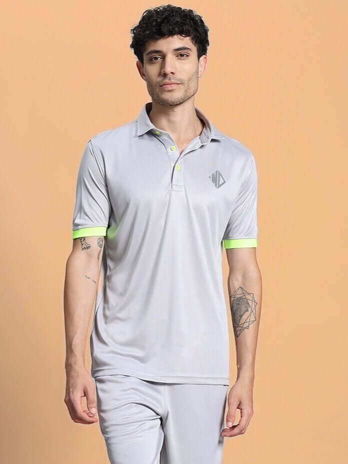 Model wearing grey regular fit t-shirt made from premium sports polyester fabric, showcasing comfort and style.