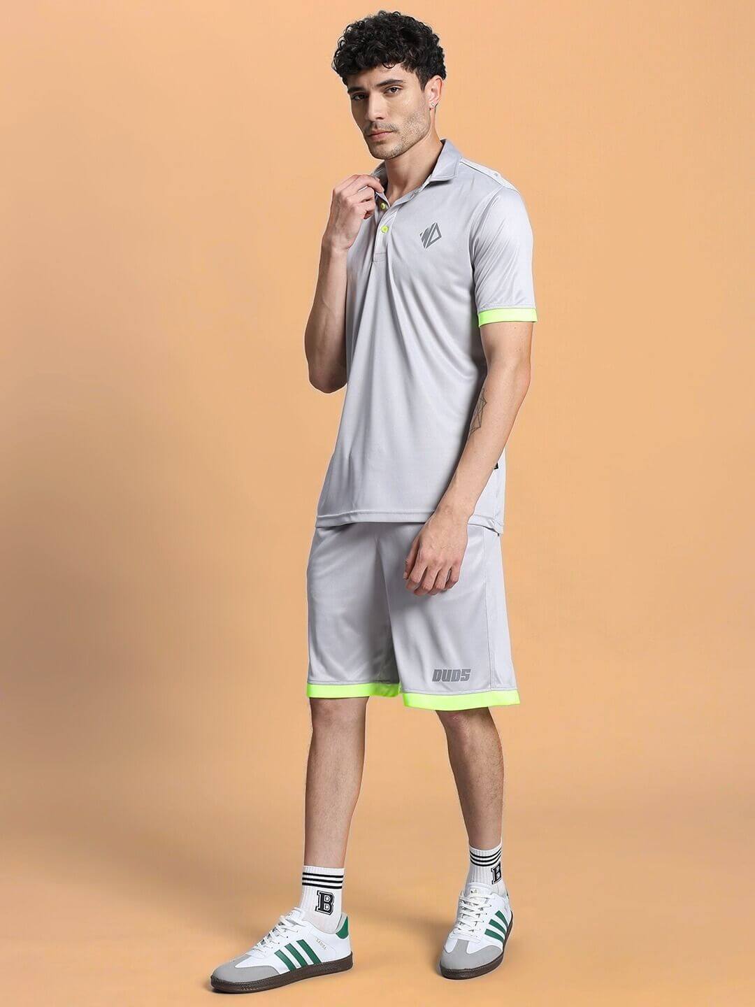 Man modeling HOOKUP SUMMER POLYESTER CO-ORD SET GREY, showcasing sporty and stylish summer attire.