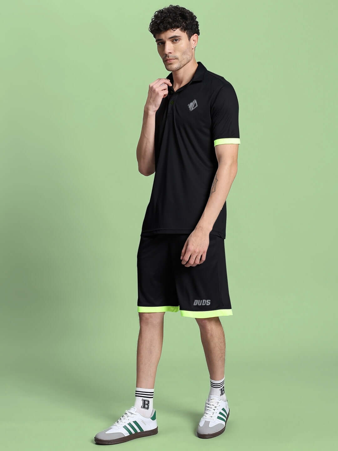 Model wearing HOOKUP REFLECTOR SUMMER CO-ORD SET BLACK, stylish unisex outfit for warm weather with neon accents, breathable and quick-dry fabric.