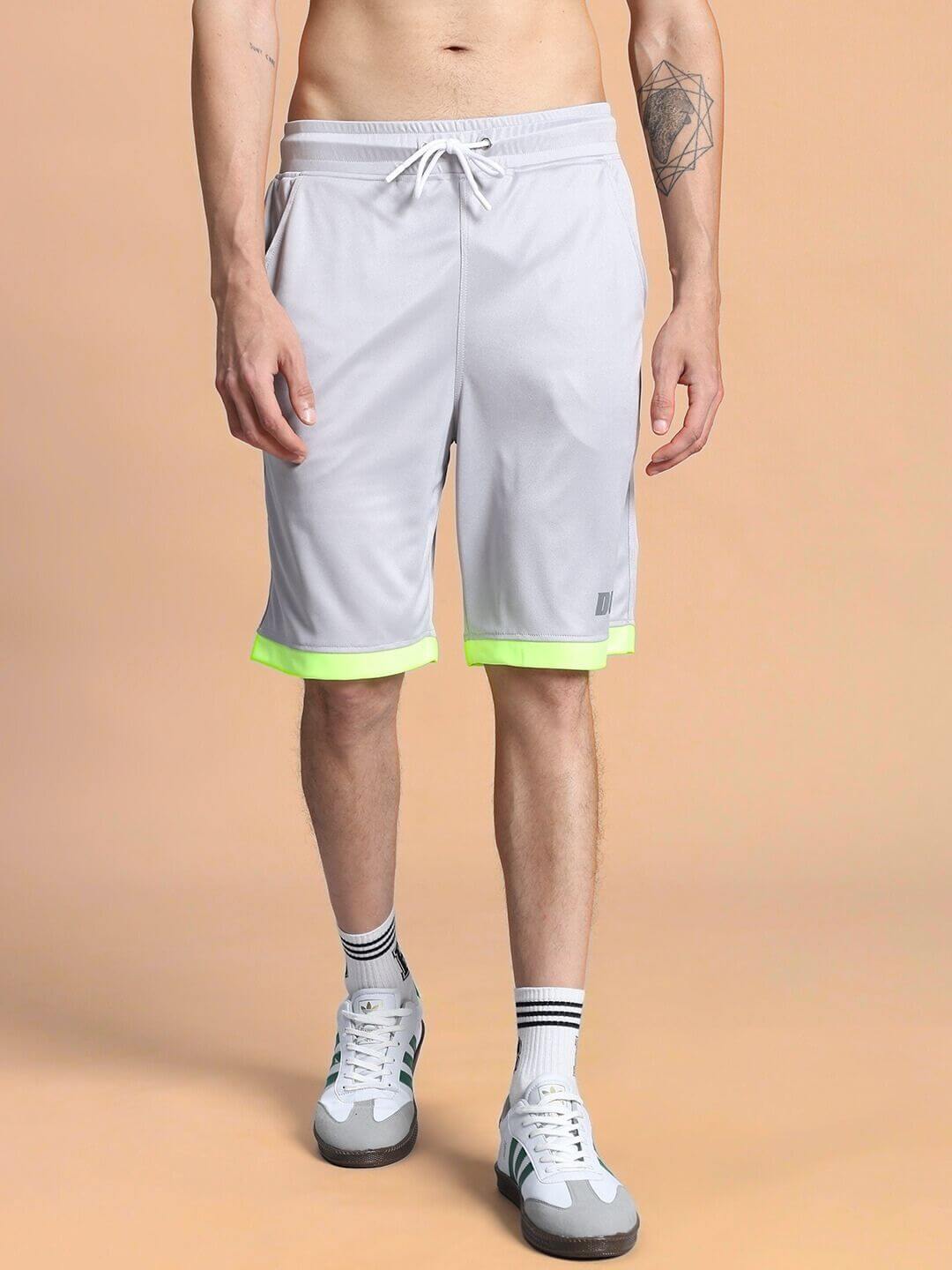 Man wearing HOOKUP REGULAR FIT SHORTS GREY, showing relaxed fit and contemporary style.