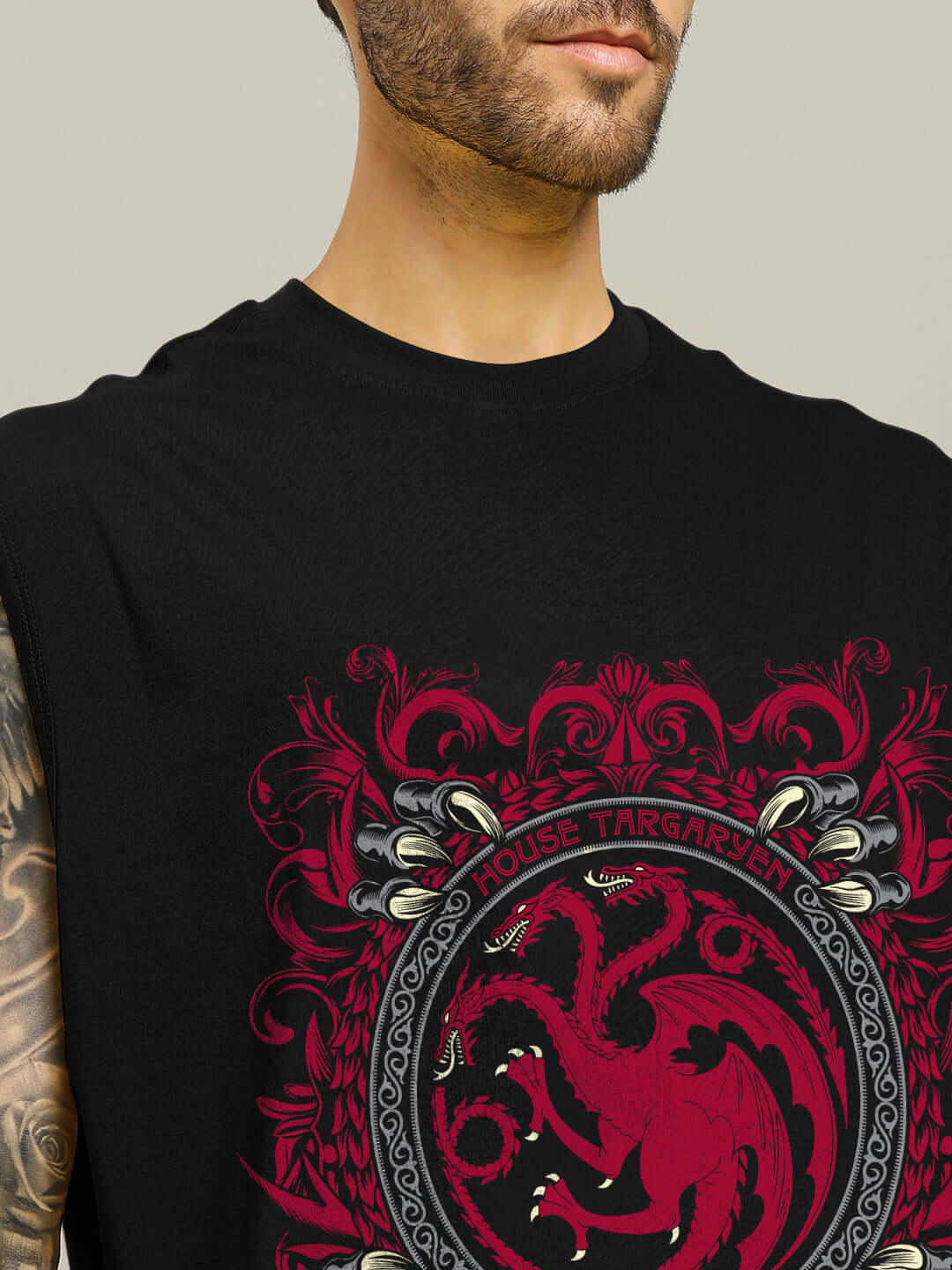 Man wearing HOUSE OF DRAGON PRINTED GYM T-SHIRT BLACK with bold dragon graphic design, close-up view.