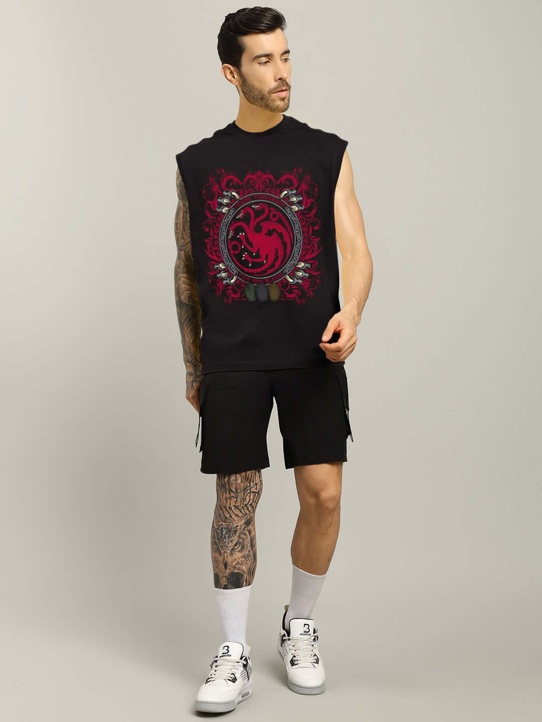 Man wearing HOUSE OF DRAGON PRINTED GYM T-SHIRT BLACK with dragon graphic, designed for style and performance in gym workouts.