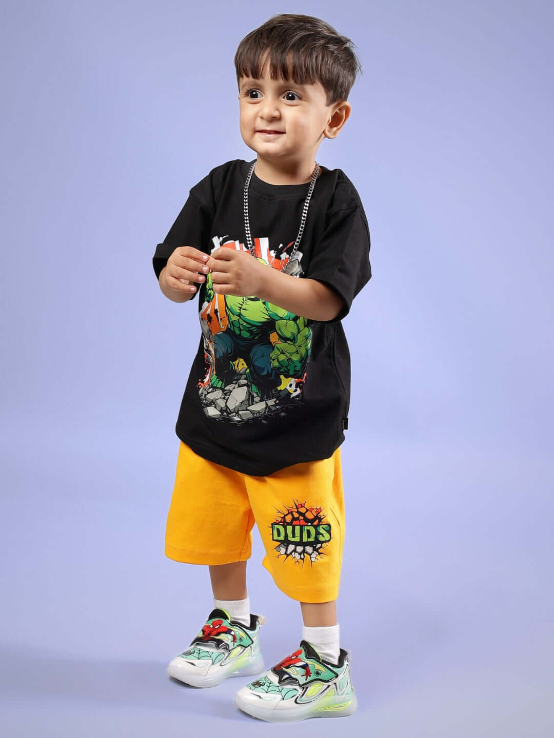 Young child wearing a black and yellow Hulk co-ord set from DUDS, showcasing playful superhero style for boys and girls.