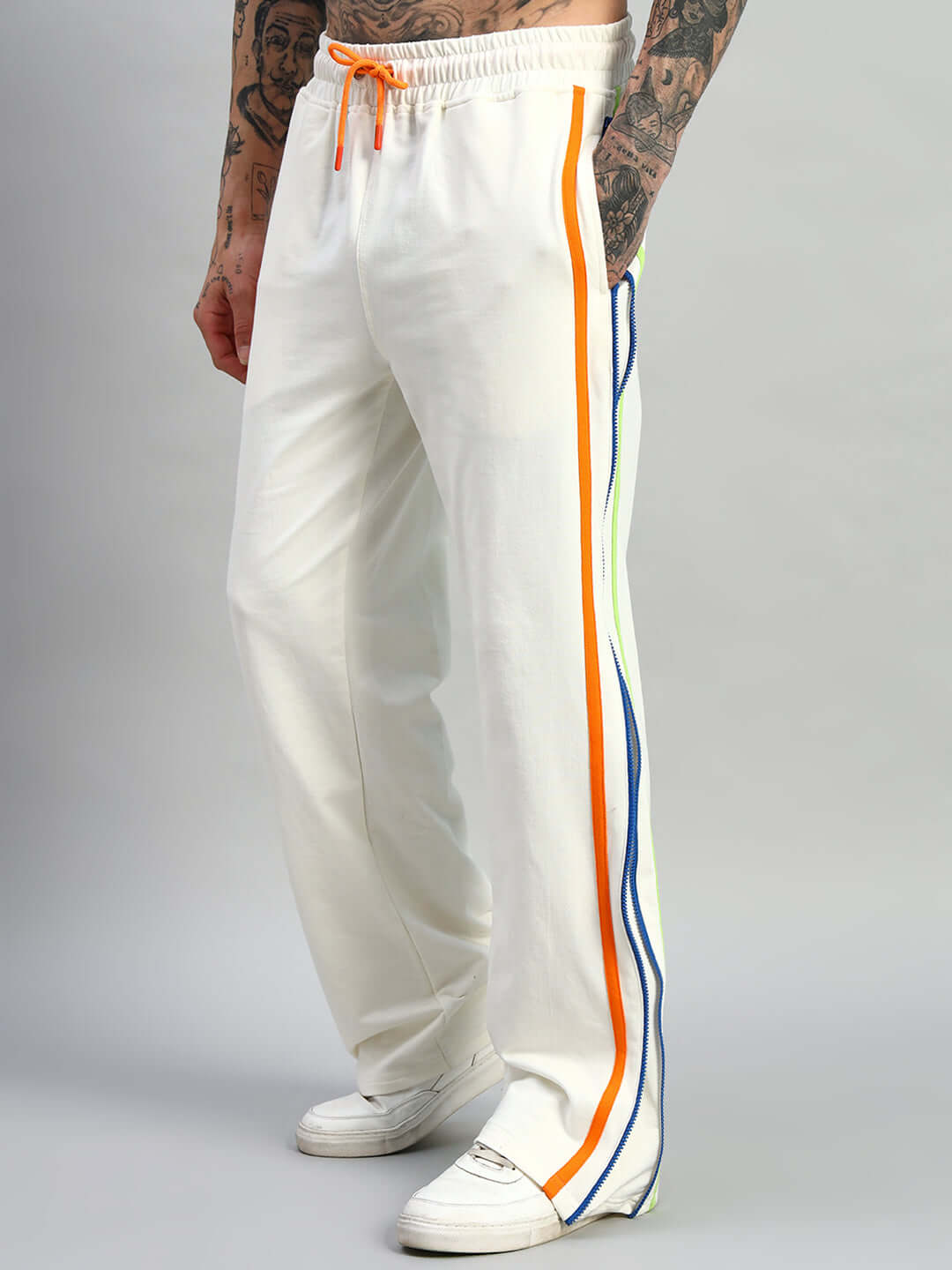 Off-white Imperial joggers with side zipper and colorful stripe detailing, modeled for DUDS, tailored fit, customizable size option.