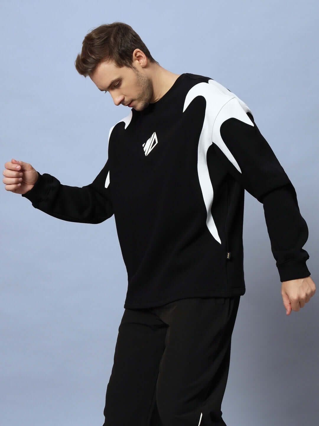 Person wearing Infinity Saga Oversized Fleece Sweatshirt Black, showcasing relaxed fit and stylish design.