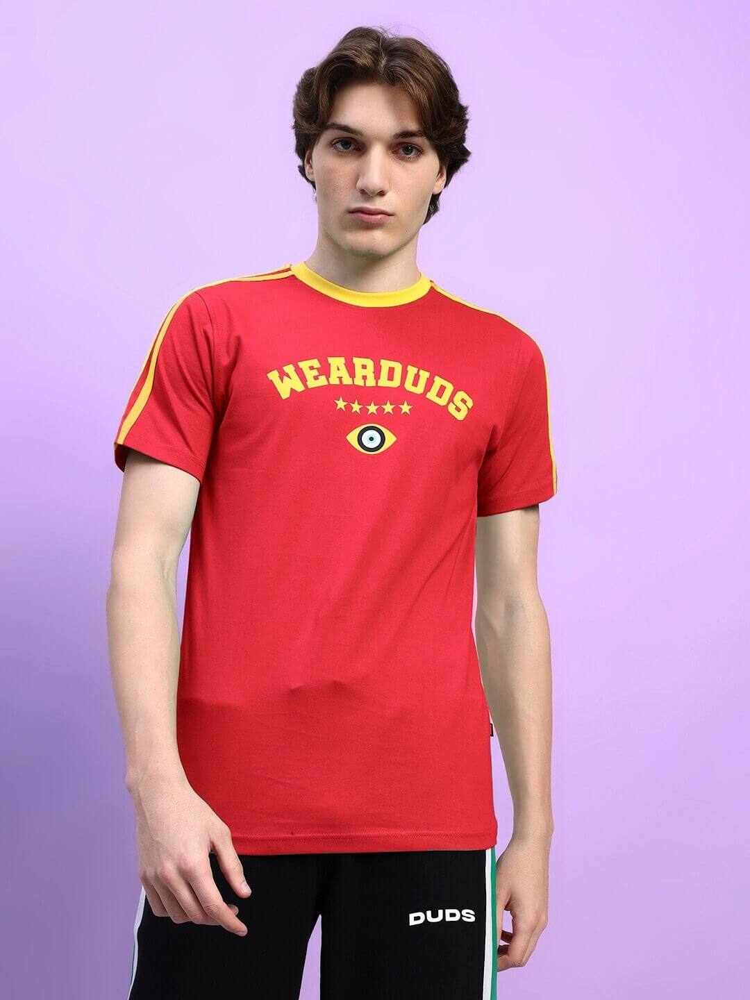 Man wearing red Irish Regular Fit T-Shirt with yellow text on the chest, showcasing the vibrant color and casual style.
