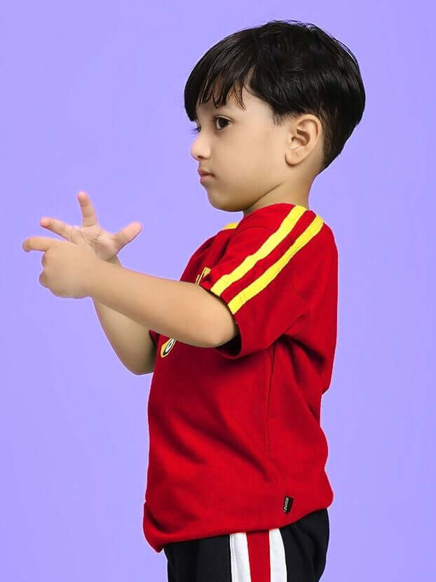 Child wearing IRISH T-SHIRT FOR BOYS AND GIRLS RED, featuring vibrant color and Irish-themed detailing, perfect for fashion-forward kids.