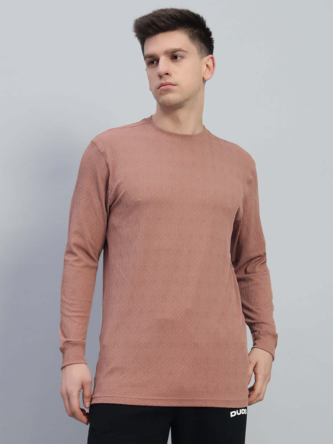 Man wearing a brown JACOB sweatshirt made of premium heavy gauge jacquard lycra fabric. Ideal for stylish, casual wear.