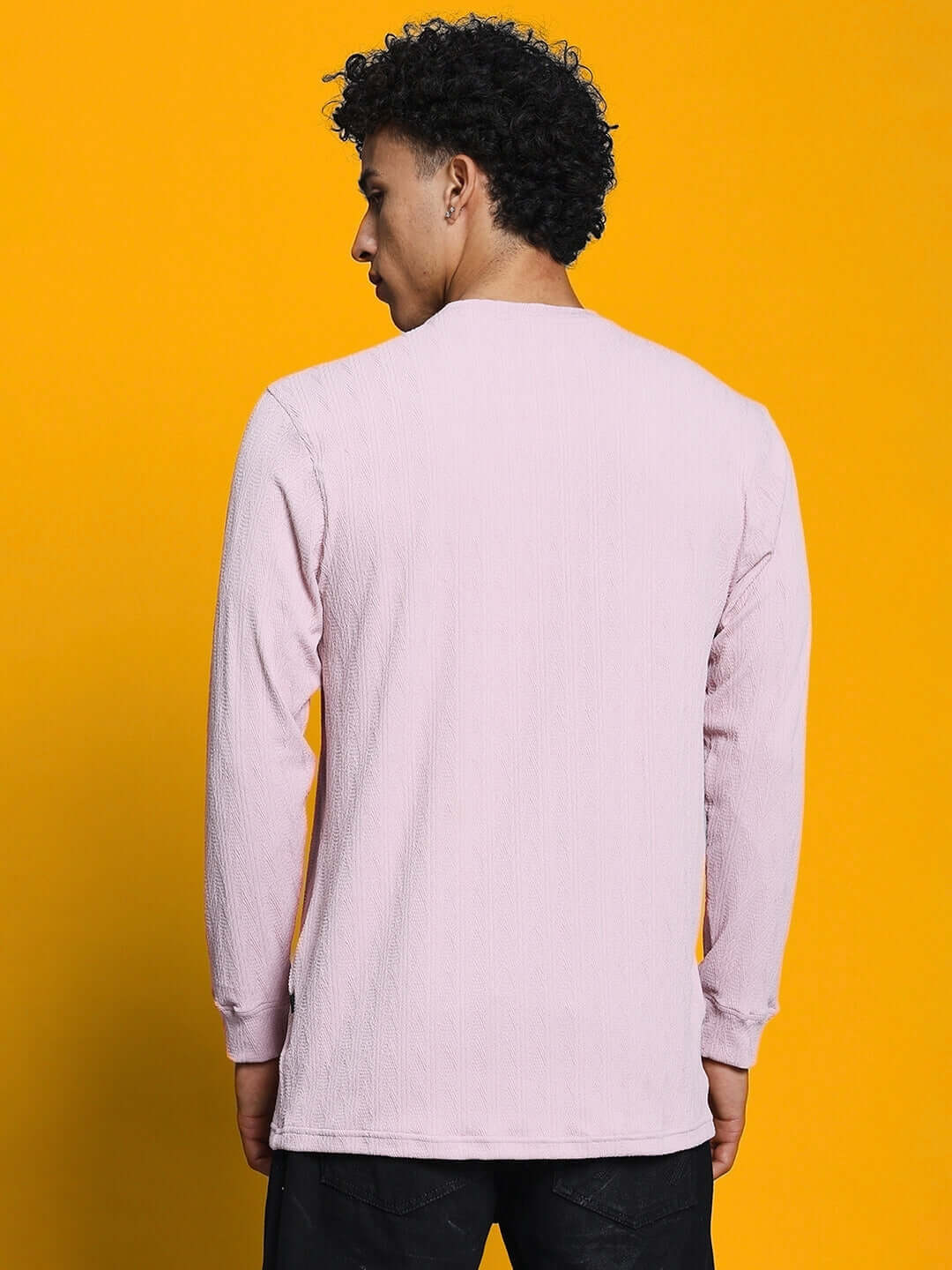 Back view of a man wearing a pink Jacob sweatshirt made from premium heavy gauge jacquard lycra fabric, perfect for casual wear.