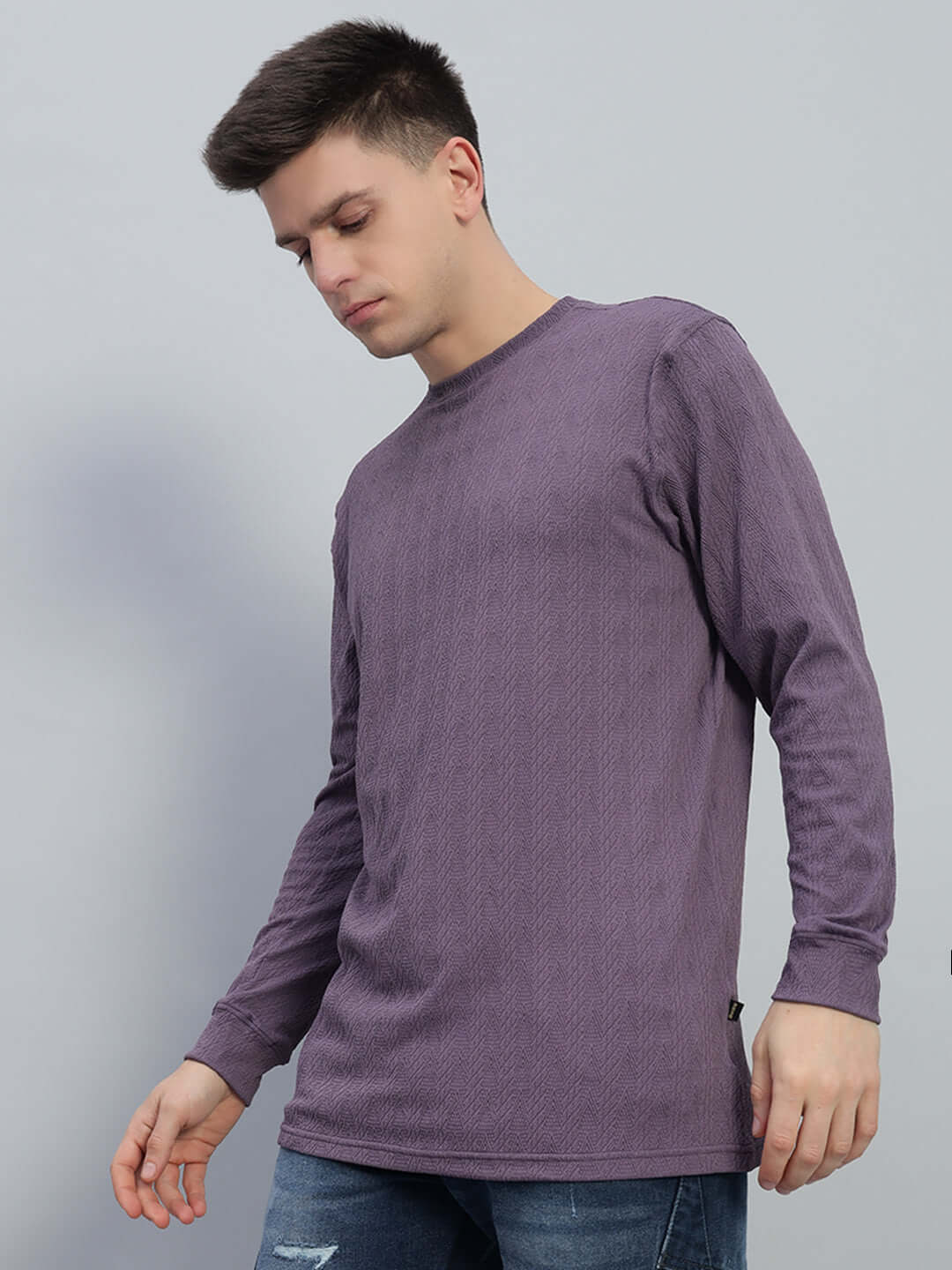 Man wearing purple Jacob sweatshirt made from premium jacquard lycra fabric, emphasizing comfort and style. Cold machine wash recommended.