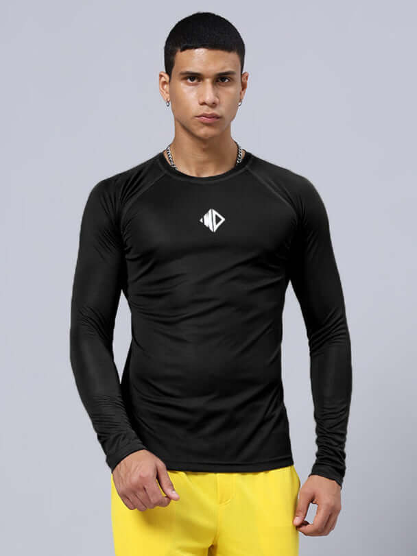 Model wearing JAMES REGULAR FIT T-SHIRT BLACK made of sports polyester, perfect for active wear, shown with yellow pants.