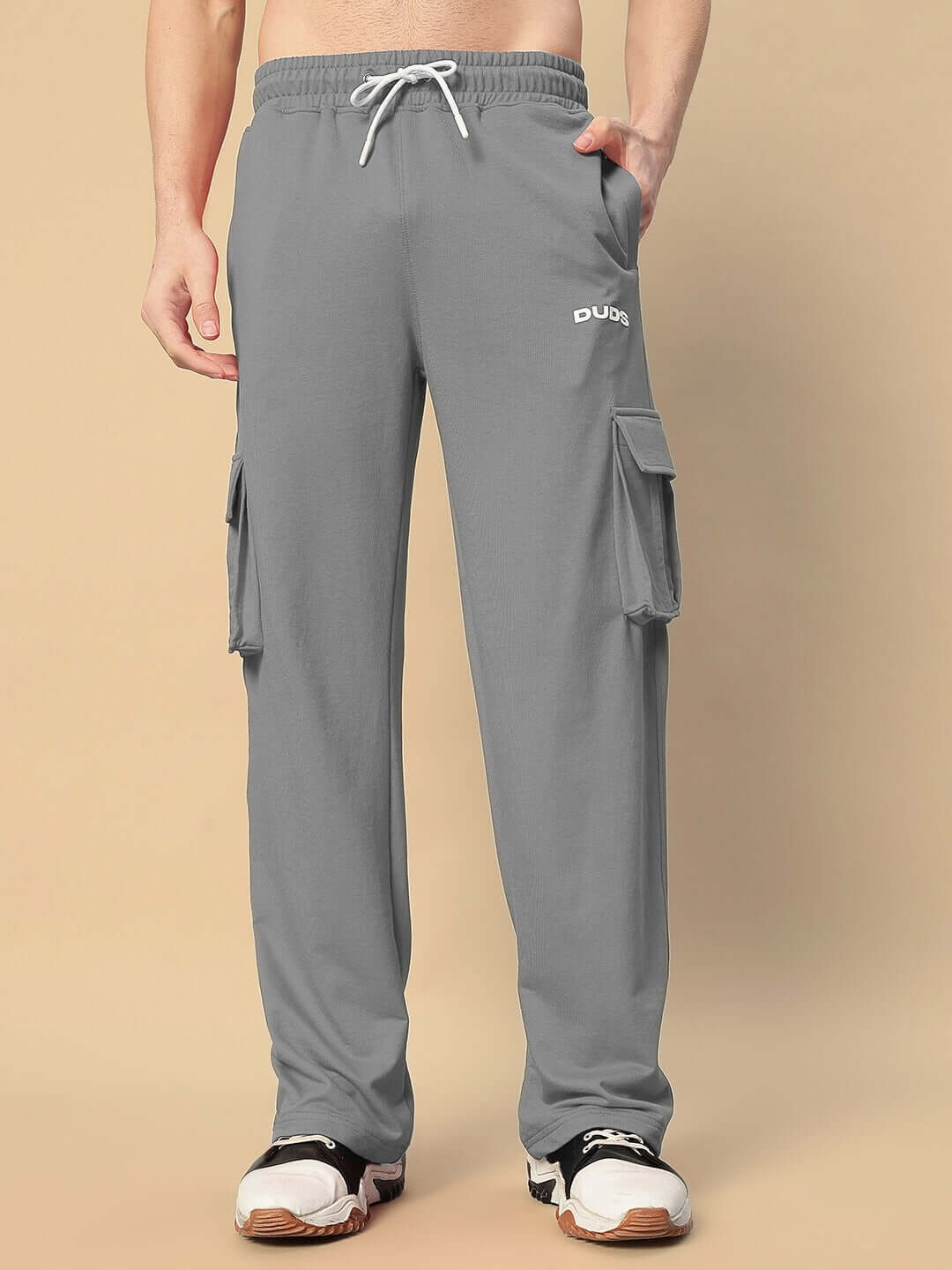 Model wearing grey JESS 5 Pocket Relaxed Fit Joggers by DUDS, featuring cargo pockets and drawstring waist.
