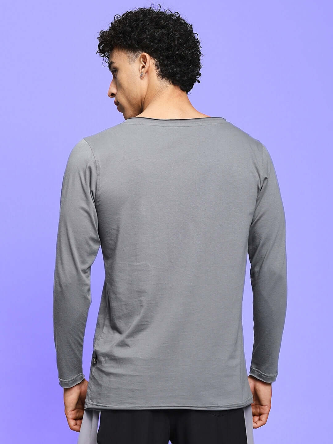 Model wearing grey JOEL slim fit sweatshirt, showcasing back view, made from premium 100% cotton fabric.